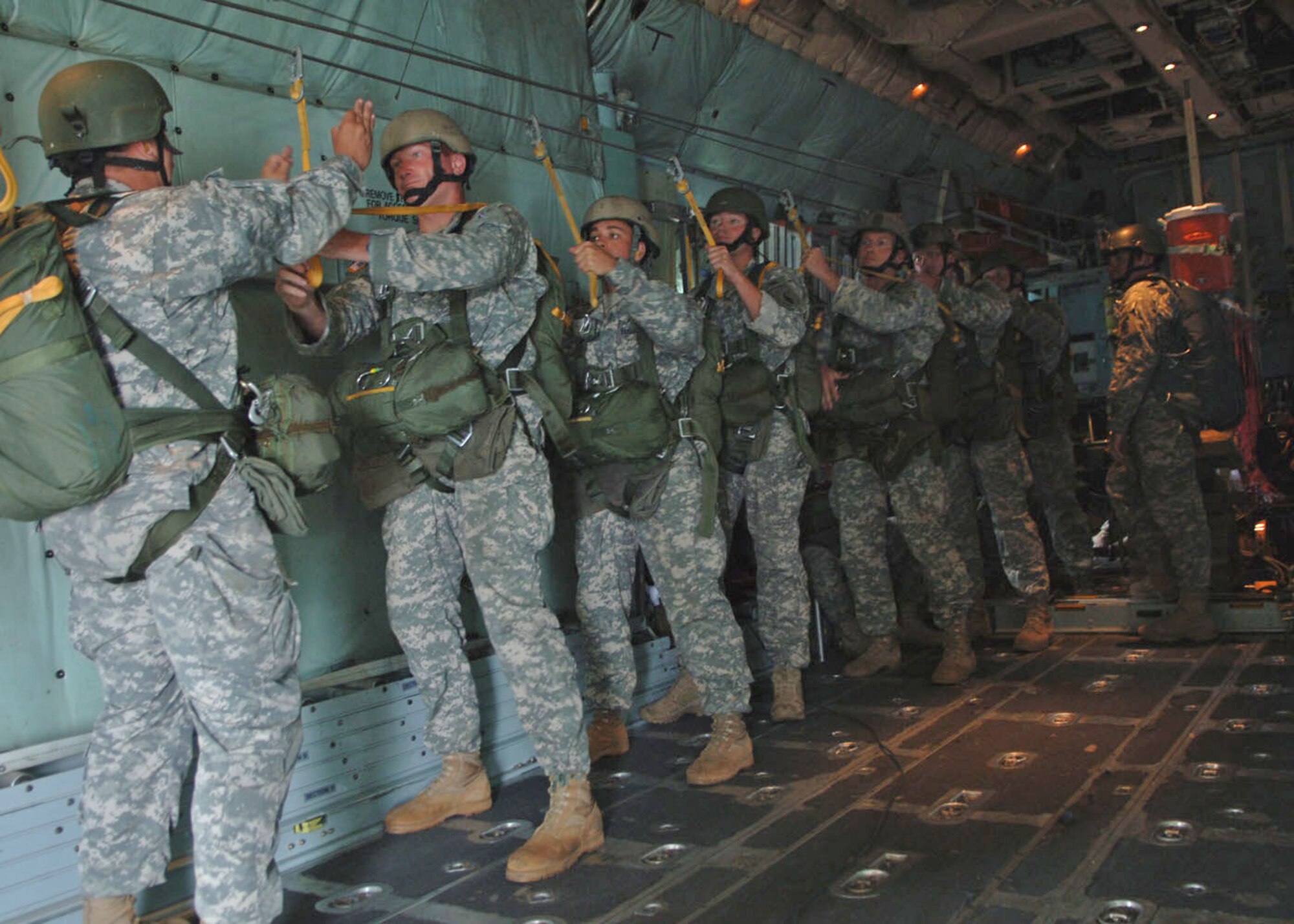 070825 YOKOTA AIR BASE, Japan -- Personnel from the United States Army's 1st Battalion 1st Special Forces Group  prepare perform a static line parachute jump out of a C-130 Hercules flown by the 36th Airlift Squadron from Yokota during the 2007 Japanese-American Friendship Festival. Yokota has hosted the Friendship Festival for 57 years, this year an estimated 120,000 guest participated in the festivities.
(U.S. Air Force photo by Senior Airman Veronica Pierce)