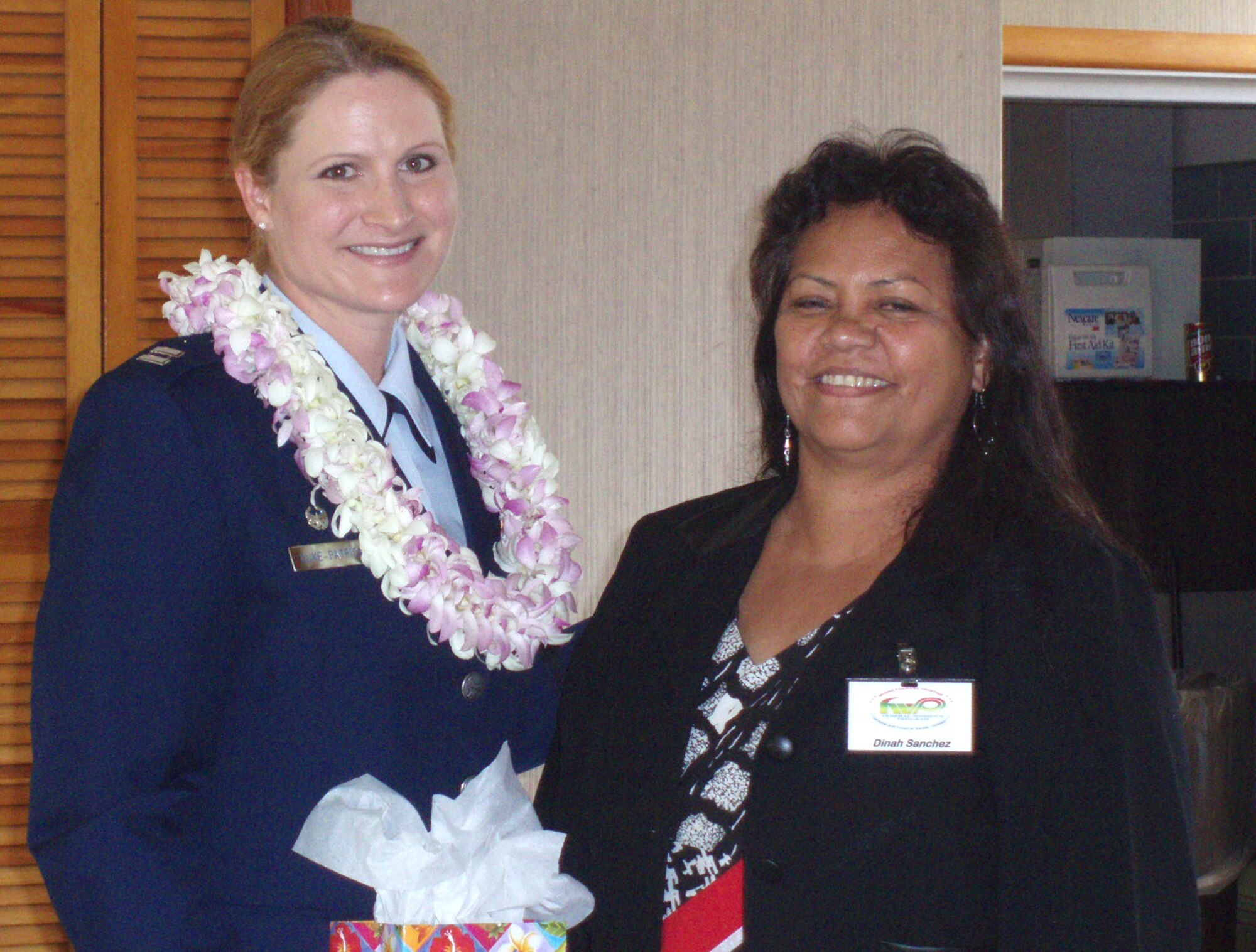 A Federal Women’s Program Equality Day Luncheon in celebration of the 85th Anniversary of Women’s Equality Day.  Guest speaker, Captain Tamara Duke-Patrick (left) and FWP President, Dinah Sanchez (right)