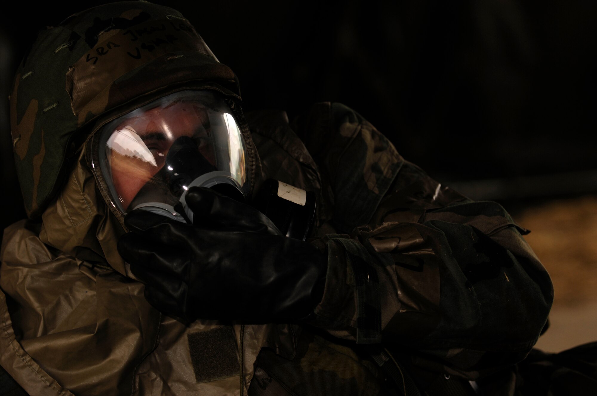 VANDENBERG AIR FORCE BASE, Calif. -- Senior Airman Jason Levy, 614th Space Communications Squadron, dons his gas mask during a chemical attack exercise during North Star on Aug. 23. North Star is designed to teach Airmen the combat skills needed while deployed. (U.S. Air Force photo/Airman 1st Class Christian Thomas)

