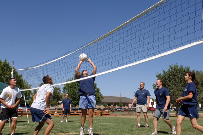 Members of the 75th Air Base Wing Public Affairs office square off against members from the 649th Munitions Squadron in volleyball during the Air Force 60th Birthday Bash Sports Day. Other competitive activities were included such as horse shoes, tug o' war, table tennis, arm wrestling and disc golf.
