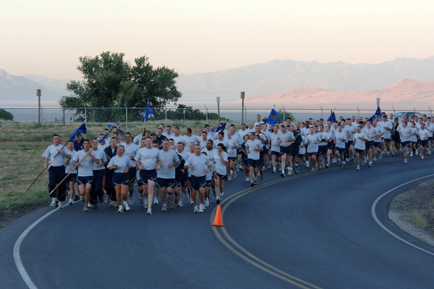 Squadrons from the 75th Air Base Wing participated in a formation run early Aug. 24 for the kick off of sports day. The run was led by Col. Linda Medler, 75th Air Base Wing vice commander, and Chief Master Sgt. William Gurney, Ogden Air Logistics Center and 75th Air Base Wing command chief. (U.S. Air Force Photo by Alex R. Lloyd)
