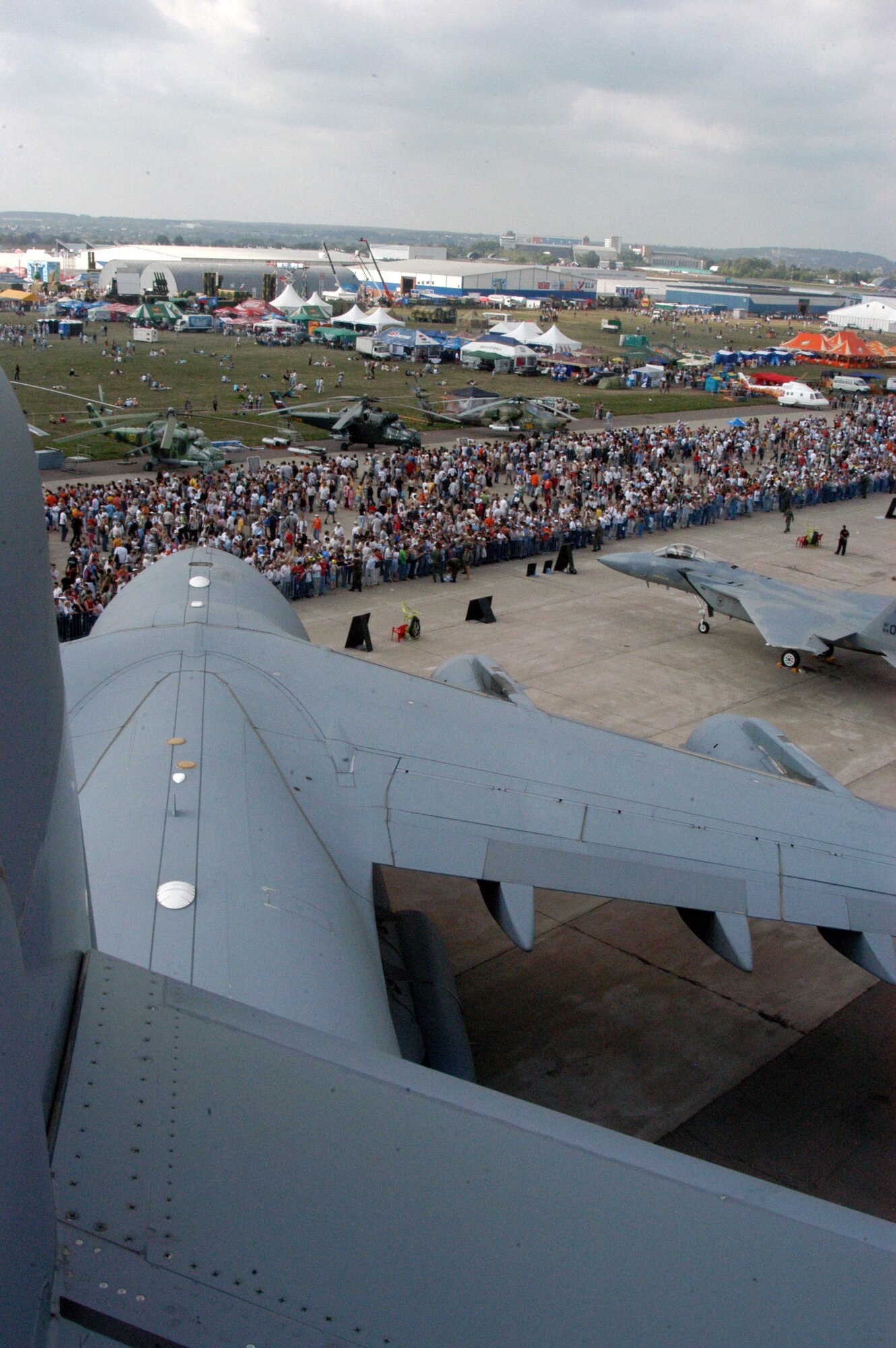 A view from the tail of the C-17 Globemaster III shows just some of the thousands of people who visited the Moscow International Air Show Aug. 26 in Zhukovsky, Russia. A KC-135 Stratotanker from Royal Air Force Mildenhall, England; an F-15 Eagle from RAF Lakenheath, England; a B-52 from Barksdale Air Force Base, La.; a C-17 Globemaster II from McChord AFB, Wash., and two F-16 Fighting Falcons from Spangdahlem Air Base, Germany, were on static display at the air show, along with many other aircraft from all over the world. The air show began Aug. 21 and concluded Aug. 26, and had more than 500,000 visitors. (U.S. Air Force photo/Maj. Pamela A.Q. Cook) 
