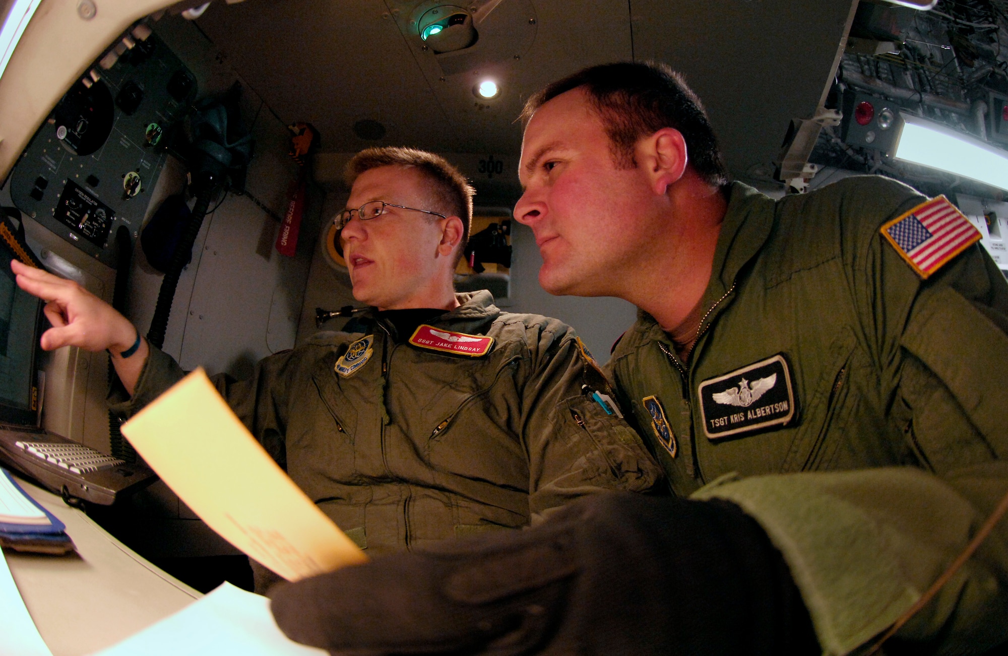 Staff Sgt. Jake Lindsay and Kris Albertson go over their load plan on a C-17 Globemaster III Aug. 25, 2007 at Christchurch New Zealand during Operation Deep Freeze. A C-17 and 31 Airmen from McChord Air Force Base, Wash. are conducting the annual winter fly-in augmentation of scientist, support personnel, food and equipment for the U.S. Antarctic Program at McMurdo Station, Antarctica. WinFly is the opening of the first flights to McMurdo station, which closed for the austral winter in Feb. (U.S. Air Force photo/Tech. Sgt. Shane A. Cuomo