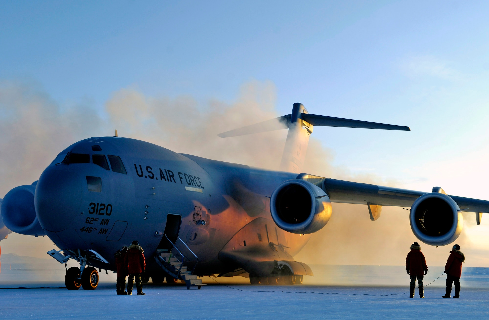 Exhaust vapors form around a C-17 Globemaster III after engine start-up during an Operation Deep Freeze winter fly-in mission Aug. 25 at Pegasus White Ice Runway, Antarctica. A C-17 and 31 Airmen from McChord Air Force Base, Wash., conducted the annual winter fly-in augmentation of scientists, support staff, food and equipment for the U.S. Antarctic Program at McMurdo Station, Antarctica. (U.S. Air Force photo/Tech. Sgt. Shane A. Cuomo) 
