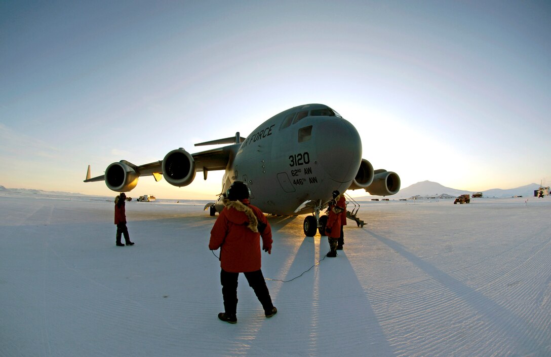 A loadmaster and maintenance members conduct preflight checks on a C-17 Globemaster III before taking off on an Operation Deep Freeze winter fly-in mission Aug. 25 from Pegasus White Ice Runway, Antarctica. A C-17 and 31 Airmen from McChord Air Force Base, Wash., conducted the annual winter fly-in augmentation of scientists, support staff, food and equipment for the U.S. Antarctic Program at McMurdo Station, Antarctica. (U.S. Air Force photo/Tech. Sgt. Shane A. Cuomo) 
