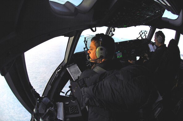 Capt. Cory Simmons and Lt. Col. Scott Weichert approach Pegasus White Ice Runway, Antarctica, in their C-17 Globemaster III Aug. 25 during a winter fly-in mission for Operation Deep Freeze. A C-17 and 31 Airmen from McChord Air Force Base, Wash., conducted the annual winter fly-in augmentation of scientists, support staff, food and equipment for the U.S. Antarctic Program at McMurdo Station, Antarctica. (U.S. Air Force photo/Tech. Sgt. Shane A. Cuomo) 
