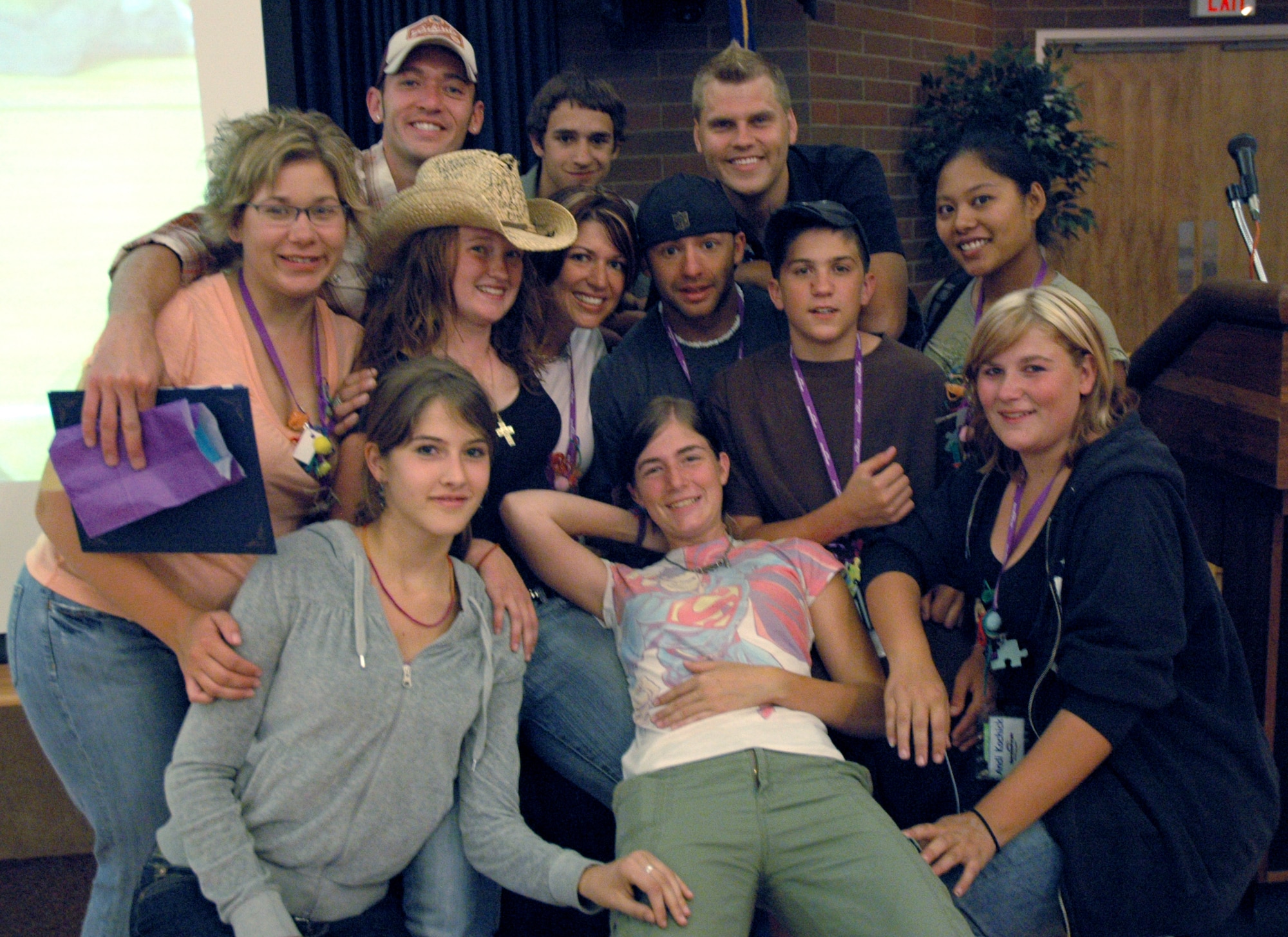 MOUNTAIN HOME AIR FORCE BASE, Idaho -- During the last day of camp, some campers huddle around five of the camp counselors for one last photo. Operation Purple Camp Idaho is a camp exclusively for military children. During the week-long camp, the campers stayed at Cascade Lake campground, participated in whitewater rafting, zip line tour, rock climbing, horseback riding, bowling and ice skating in between life lessons taught by the counselors. The life lessons helped campers adapt to parent’s deployments and family reintegration. (U.S. Air Force photo/ Senior Airman Megan P. Lyon)