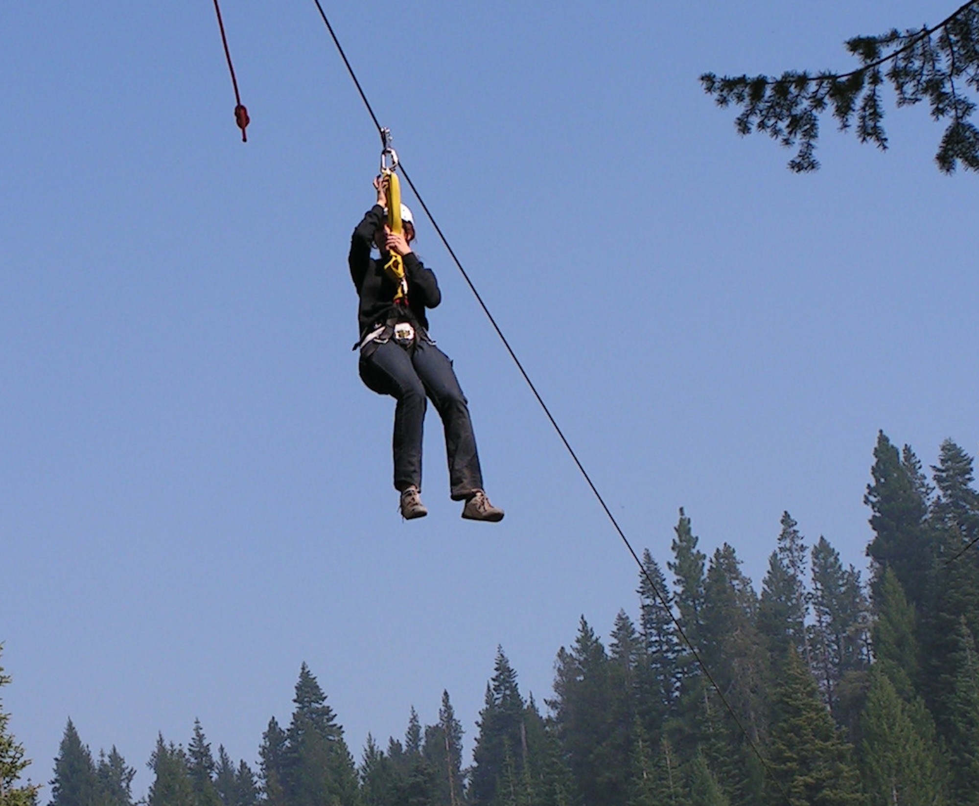 MOUNTAIN HOME AIR FORCE BASE, Idaho -- A camper participating in Operation Purple Camp Idaho, a camp exclusively for military children, rides down a zip line. During the week-long camp, the campers stayed at Cascade Lake campground, participated in whitewater rafting, zip line tour, rock climbing, horseback riding, bowling and ice skating in between life lessons taught by the counselors. The life lessons helped campers adapt to parent’s deployments and family reintegration. (U.S. Air Force photo)