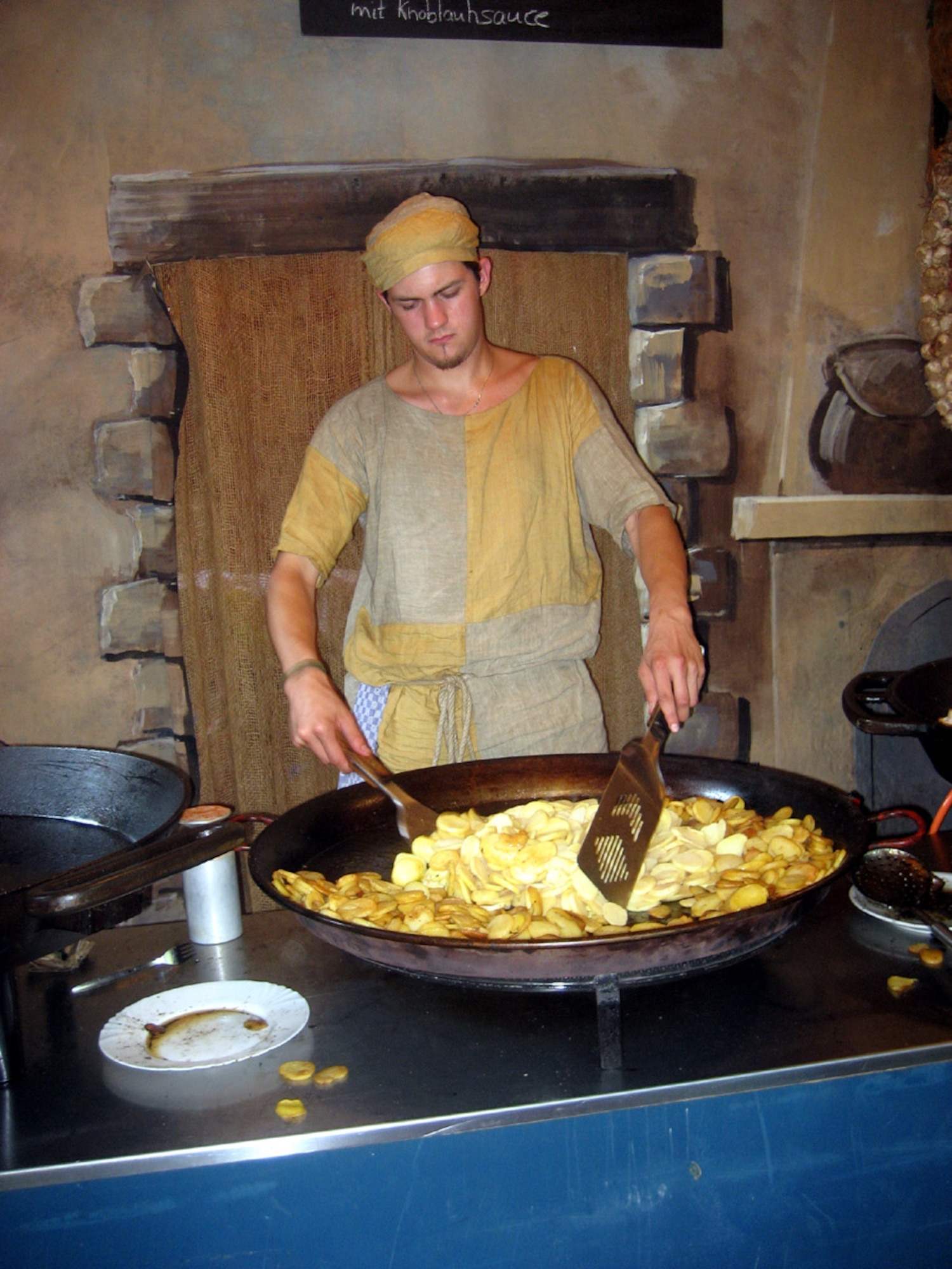 SPANGDAHLEM AIR BASE, Germany – A cook prepares a variety of meats for hungry festival goers at the Manderscheid Jousting Festival Aug. 26. Traditional food plates included “schwenk” sandwiches, hot dogs, chicken, potatoes and salad. (U.S. Air Force photo/Staff Sgt. Andrea Knudson)