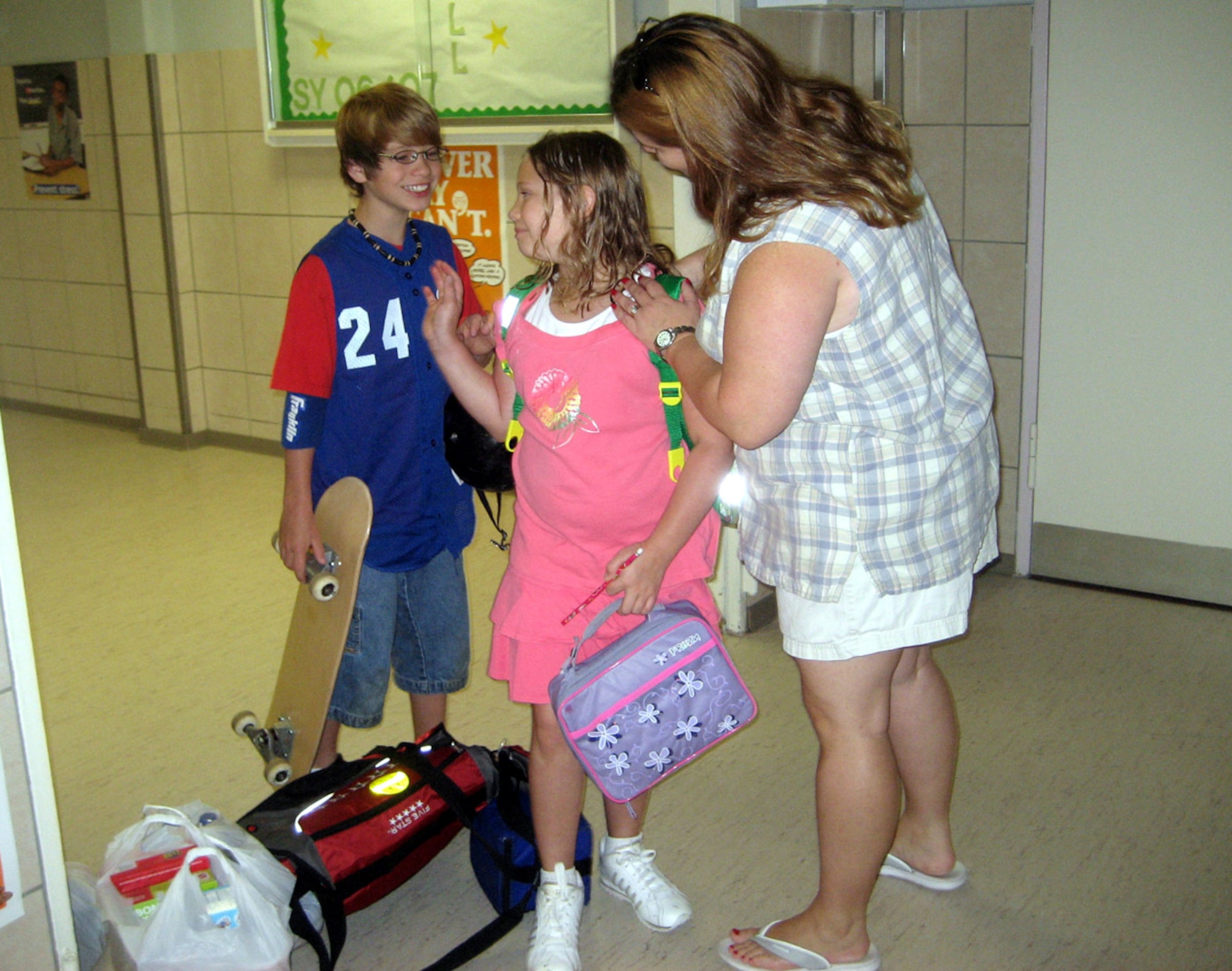 SPANGDAHLEM AIR BASE, Germany – Tammy Vaughan says goodbye to her children, Erin, 9, and Chase, 11, on the first day of school at Bitburg Middle School Aug. 27. Chase attends BMS and Erin attends Bitburg Elementary School. Their father is Tech. Sgt. Rickey Vaughan from the 52nd Communications Squadron. (U.S. Air Force photo/Staff. Sgt. Andrea Knudson)