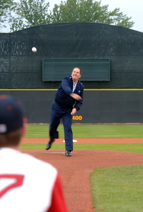 As part of Air Force Week New England festivities, Maj. Gen. Michael A. Akey, chief of staff of the Massachusetts Air National Guard, throws out the first pitch to a player on the Lowell, Mass., Spinners, a minor league baseball team of the Boston Red Sox.  (U.S. Air Force photo/Staff Sgt. Bennie J. Davis III)