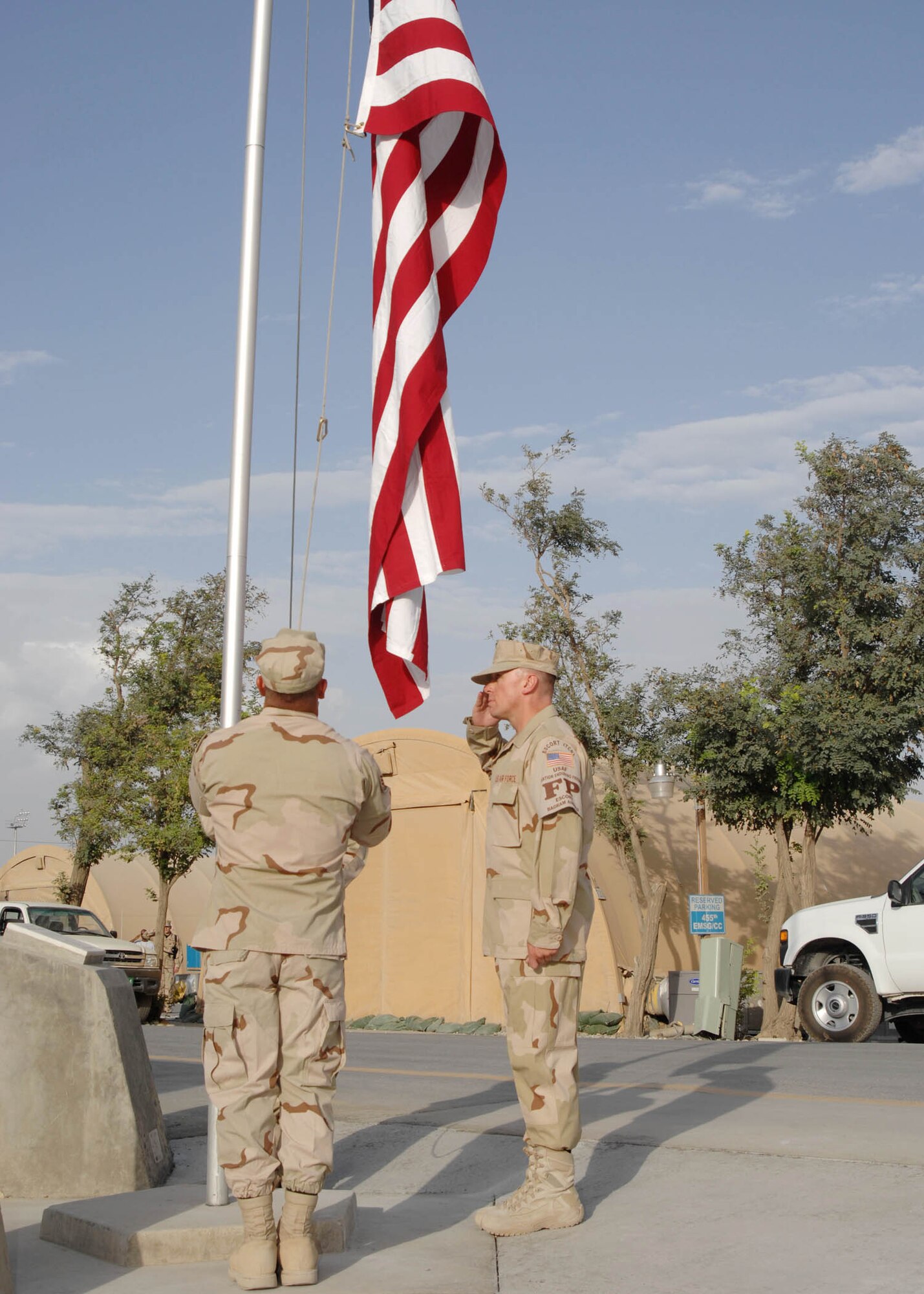 BAGRAM AIRFIELD, Afghanistan -- Force Protection members of the 455th Expeditionary Security Forces Squadron at Bagram Airfield, Afghanistan, lower the American flag during the retreat ceremony. (U.S. Air Force photo by Senior Master Sgt. Kim Allain)