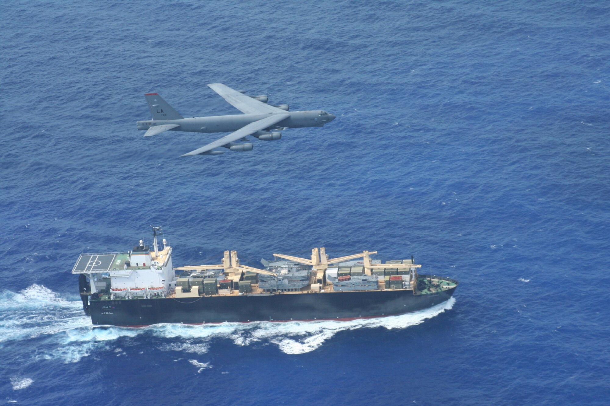 A 49th Test Evaluation Squadron B-52H Stratofortress from Barksdale Air Force Base, La., flies over the UNSN 2nd Lt John P Bobo, a maritime pre-positioning ship, during a maritime intercept training mission, Aug 24. (U.S. Air Force photo/Lt. Col. Ricardo Beruvides) 
