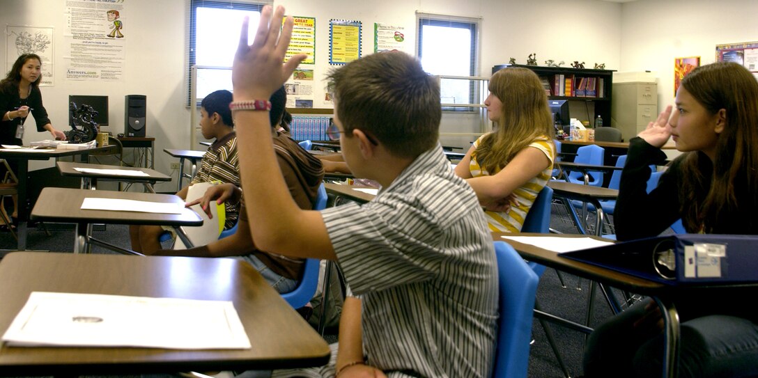 ANDERSEN AIR FORCE BASE, Guam - Nadine Johnston-Borja, sixth-grade teacher at Andersen Middle School, polls her students to see who'll buy hot lunch on the first day of school.  Andersen Middle and Elementary Schools began the 2007-2008 school year Aug. 27.  (Photo by Tech. Sgt. Brian Bahret/36th Wing Public Affairs)