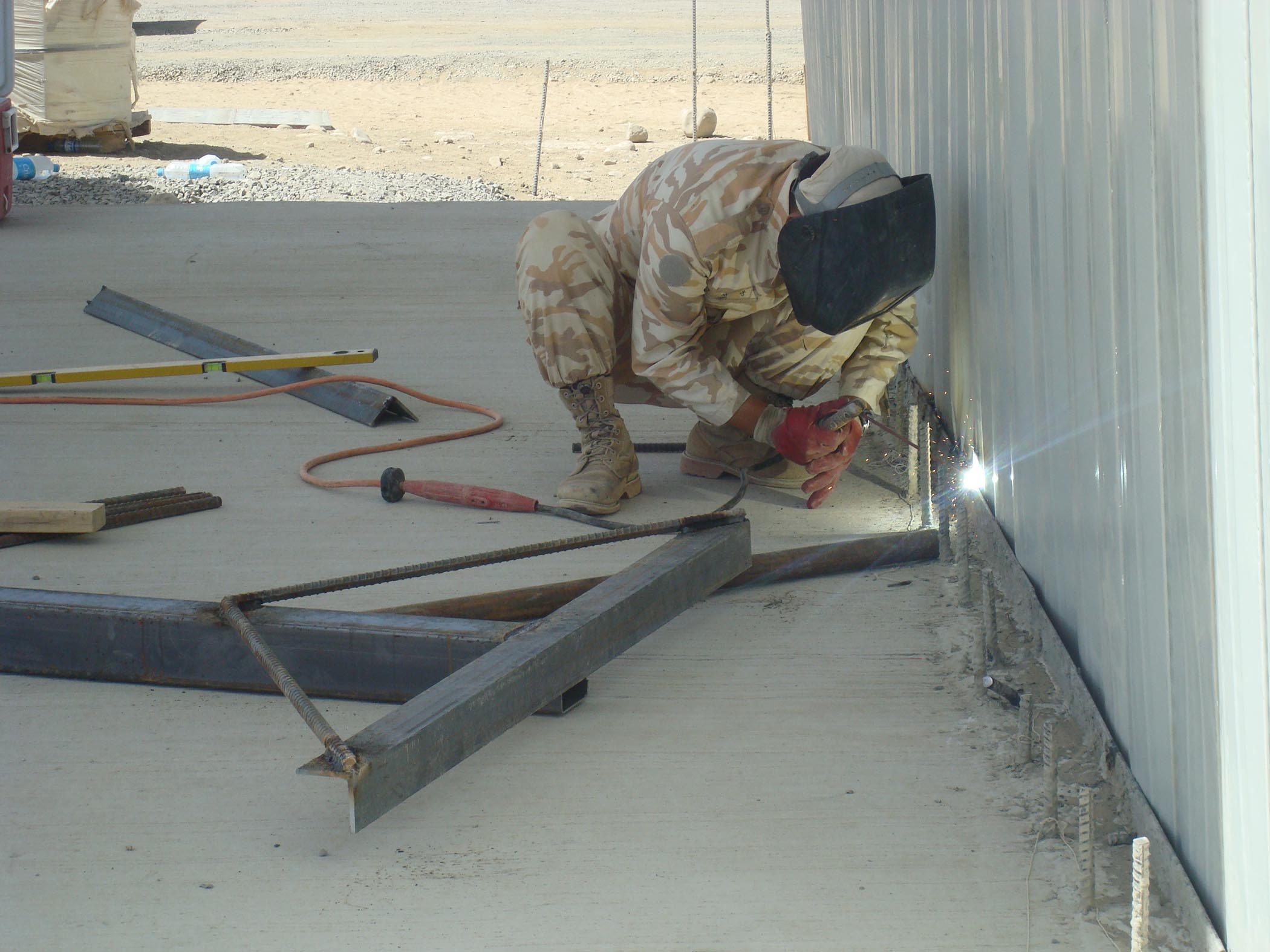Korean Engineers Work On Welding K Spans Metal Building Systems As Part Of Expanding Forward Operating