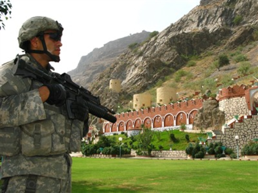 U.S. Army Sgt. Michael Espejo stands a security watch at Torkham Gate on the Pakistani border of Afghanistan on Aug 24, 2007.  Espejo and his fellow soldiers from the 66th Military Police Company, stationed out of Fort Lewis, Wash., accepted an invitation from the Afghan Border Police to take part in the Afghan Independence Day festivities at the Gate.  