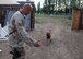 SOUTHWEST ASIA -- Tech. Sgt. John Mascolo calls for his K-9 partner Diego to join him at Manas Air Base, Kyrgyz Republic. Sergeant Mascolo and Diego are assigned to the 376th Expeditionary Security Forces Squadron and are deployed from Misawa Air Base, Japan's, 35th Security Forces Squadron's K-9 unit. (U.S. Air Force photo by Staff Sgt. Les Waters) 