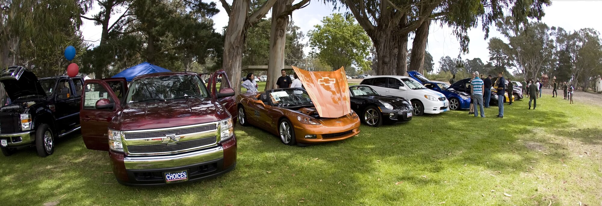 VANDENBERG AIR FORCE BASE, Calif. -- Motor entheusiasts check out dozens of show-room quality vehicles during the Texas Blowout Barbecue on Aug. 24.  The event raised more than $18,000 for the 48th annual Operation Kids Christmas event, a celebration which provides more than 200 underpriveledged children with Christmas presents and a holiday dinner gift certificate.  (U.S. Air Force photo/Capt. Eric Chin)