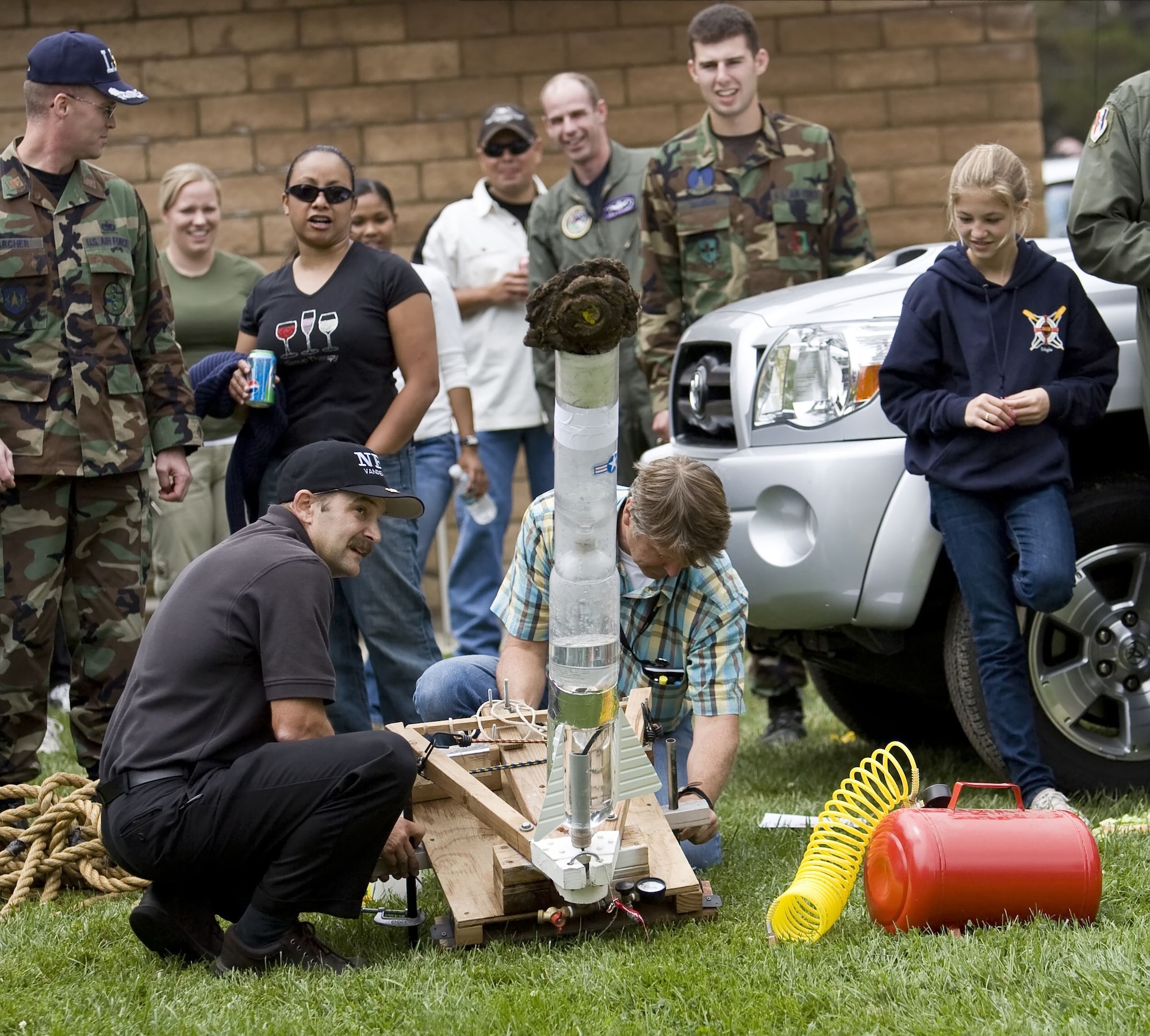 VANDENBERG AIR FORCE BASE, Calif. -- Team NRO prepares to launch their "road pie" payload several hundred yards for the cow chip toss during the Texas Blowout Barbecue on Aug. 24.  VANDENBERG AIR FORCE BASE, Calif. -- Lt. Col. Mark Danehy, 148th Space Operations Squadron commander, competes for the traveling trophy in the cow chip toss during the Texas Blowout Barbecue on Aug. 24.  The event raised more than $18,000 for the 48th annual Operation Kids Christmas event, a celebration which provides more than 200 underpriveledged children with Christmas presents and a holiday dinner gift certificate.  (U.S. Air Force photo/Capt. Eric Chin)
