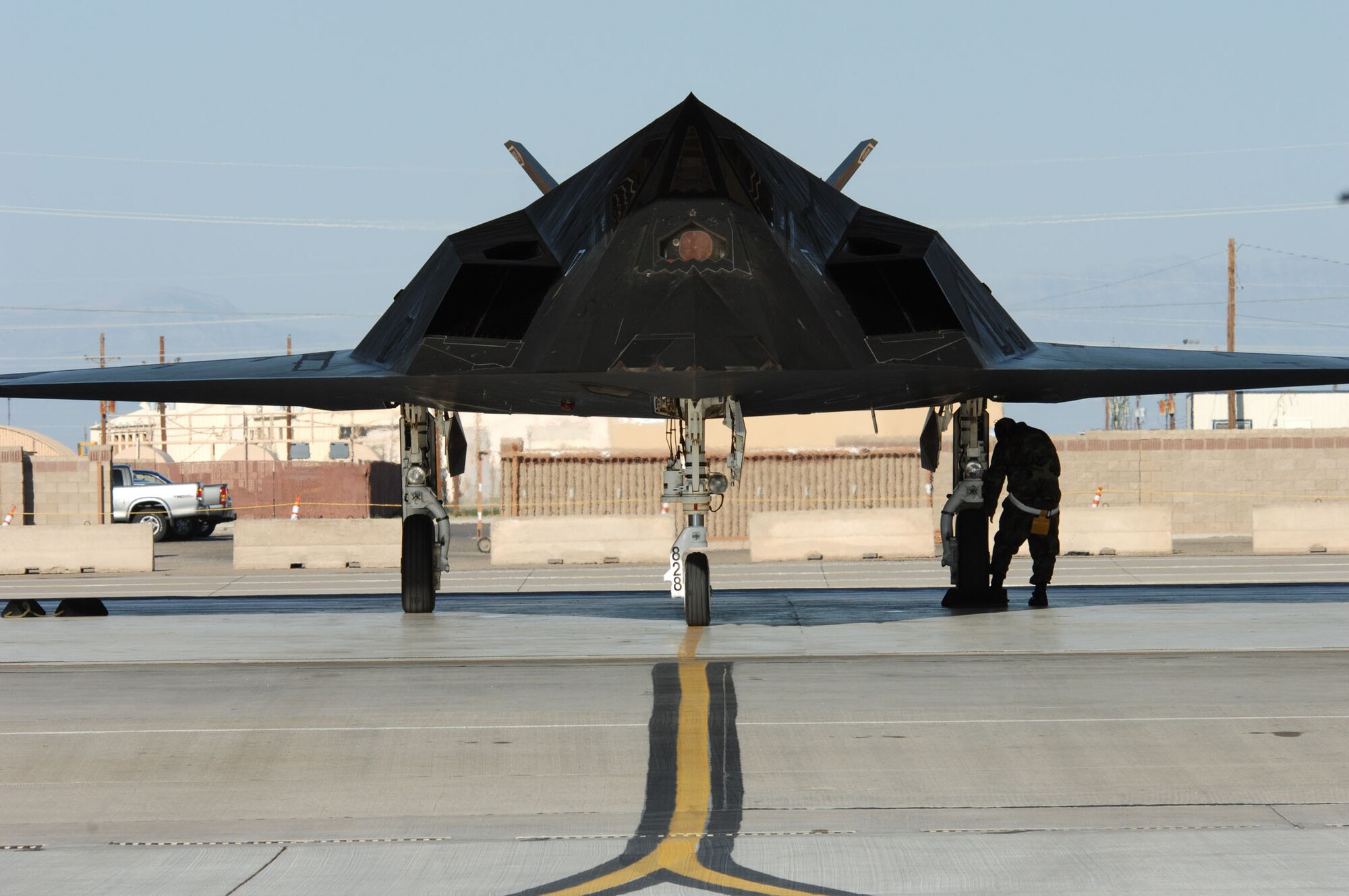An F-117A from the 49th Fighter Wing is prepared for flight by its crew. After more than 25 years of service, the stealth fighter is being retired. (U.S. Air Force photo/ Senior Airman Anthony Nelson)