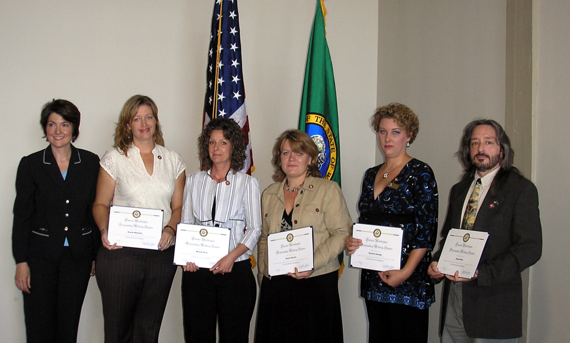 SPOKANE, Wash. – At left, Congresswoman Cathy McMorris Rodgers presents the Eastern Washington Outstanding Military Spouse award to recipients Brandi Walmsley from the Navy Operational Support Center here; and Melinda Bray, Susan Delano, Kristina Kenagy and David Allen of Fairchild Air Force Base, Wash. The award, which was presented at the Veterans and Military Resource Fair at Washington State University here Aug. 25, recognizes spouses who show exemplary commitment to family, military and nation. Nominations were based community and base involvement, overcoming challenges, impact within the military and support of their military spouse. (U.S. Air Force photo / Brian Bennett)