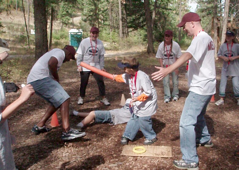 FAIRCHILD AIR FORCE BASE, Wash. – Dean Knapik (center) protects his treasure in a “Samurai Warrior” game, one of many outside activities Dean and other Fairchild elementary school students took part in during a five-day Drug Abuse Resistance Education program camp here. The Fairchild-unique program, which teaches teamwork to children from kindergarten through 12th grade, helps kids understand how and why to resist drugs and violence. (U.S. Air Force photo / Susan Conard)