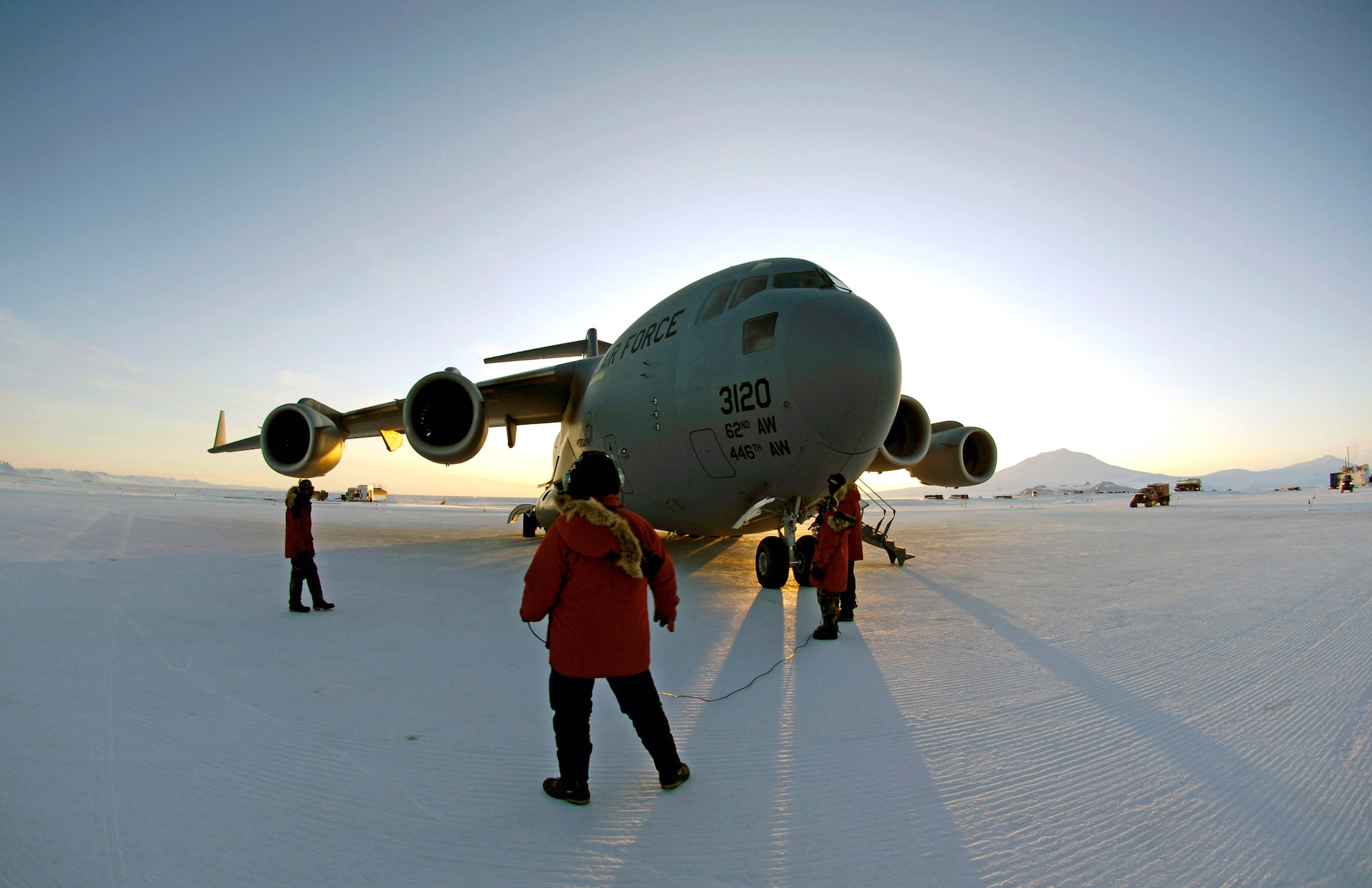 A loadmaster and maintenance members conduct preflight checks on a C-17 Globemaster III before taking off on an Operation Deep Freeze winter fly-in mission Aug. 25 from Pegasus White Ice Runway, Antarctica. A C-17 and 31 Air Force Reserve and Regular Air Force Airmen from McChord Air Force Base, Wash., conducted the annual winter fly-in augmentation of scientists, support staff, food and equipment for the U.S. Antarctic Program at McMurdo Station, Antarctica. (U.S. Air Force photo/Tech. Sgt. Shane A. Cuomo) 
