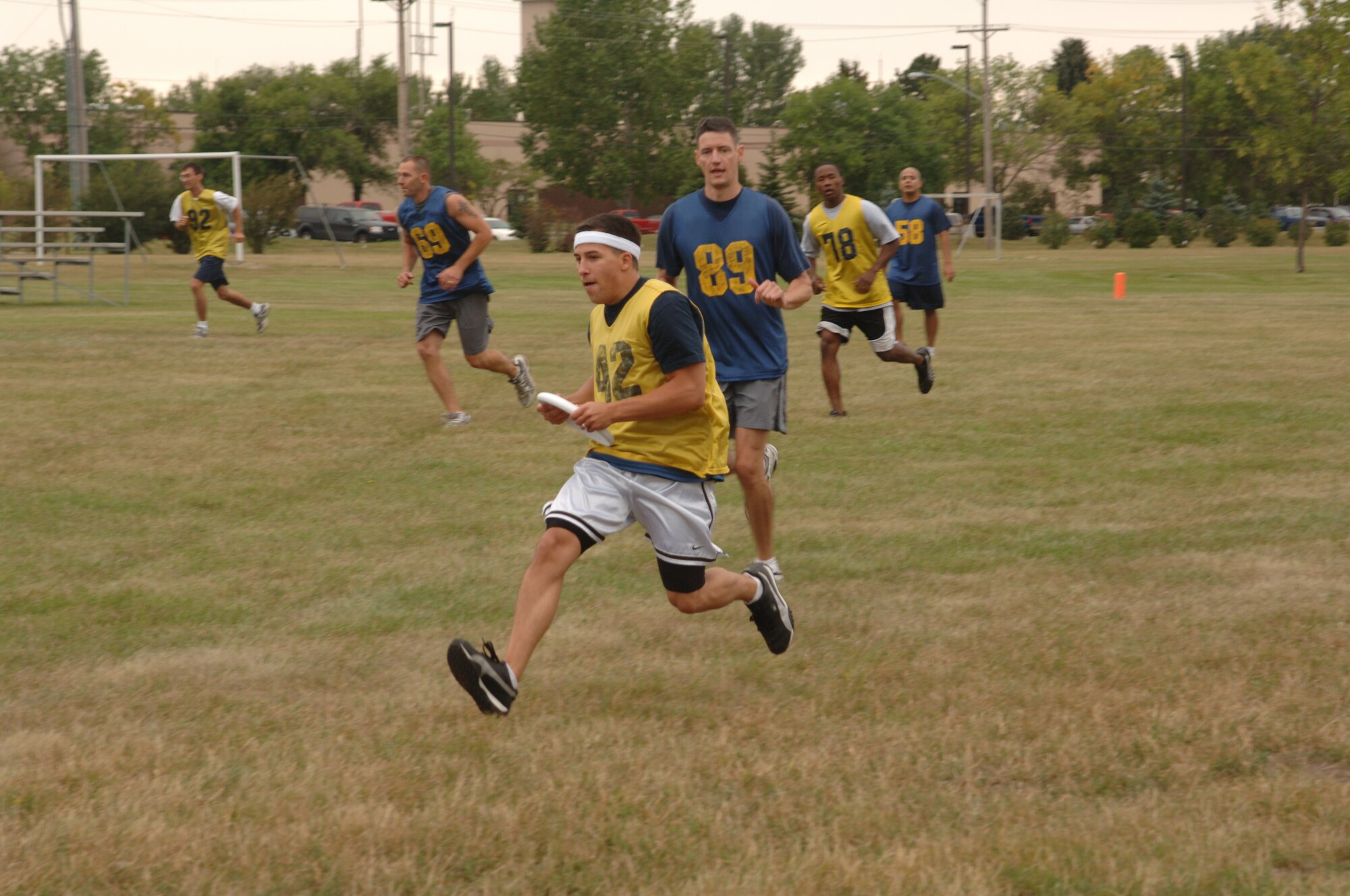 Members of the 319th Logistics Readiness and 319th Comptroller Squadron face off in a game of ultimate flying disk during the Grand Forks Air Force Base Summer Bash on August 26, 2007. The base personnel and family members participated in several sports including basketball, bowling and horse shoes.  (U.S. Air Force photo/Airman 1st Class Chad M. Kellum)