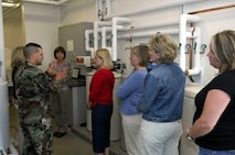 MINOT AIR FORCE BASE, N.D. -- Spouses of Airmen here receive a tour of Juliet-01, a missile alert facility, August 27.  The tour gave spouses the opportunity to see how 91st SW Airmen perform their jobs and how they live while stationed out in the missile fields. (U.S. Air Force photo by Airman 1st Class Joe Rivera)
