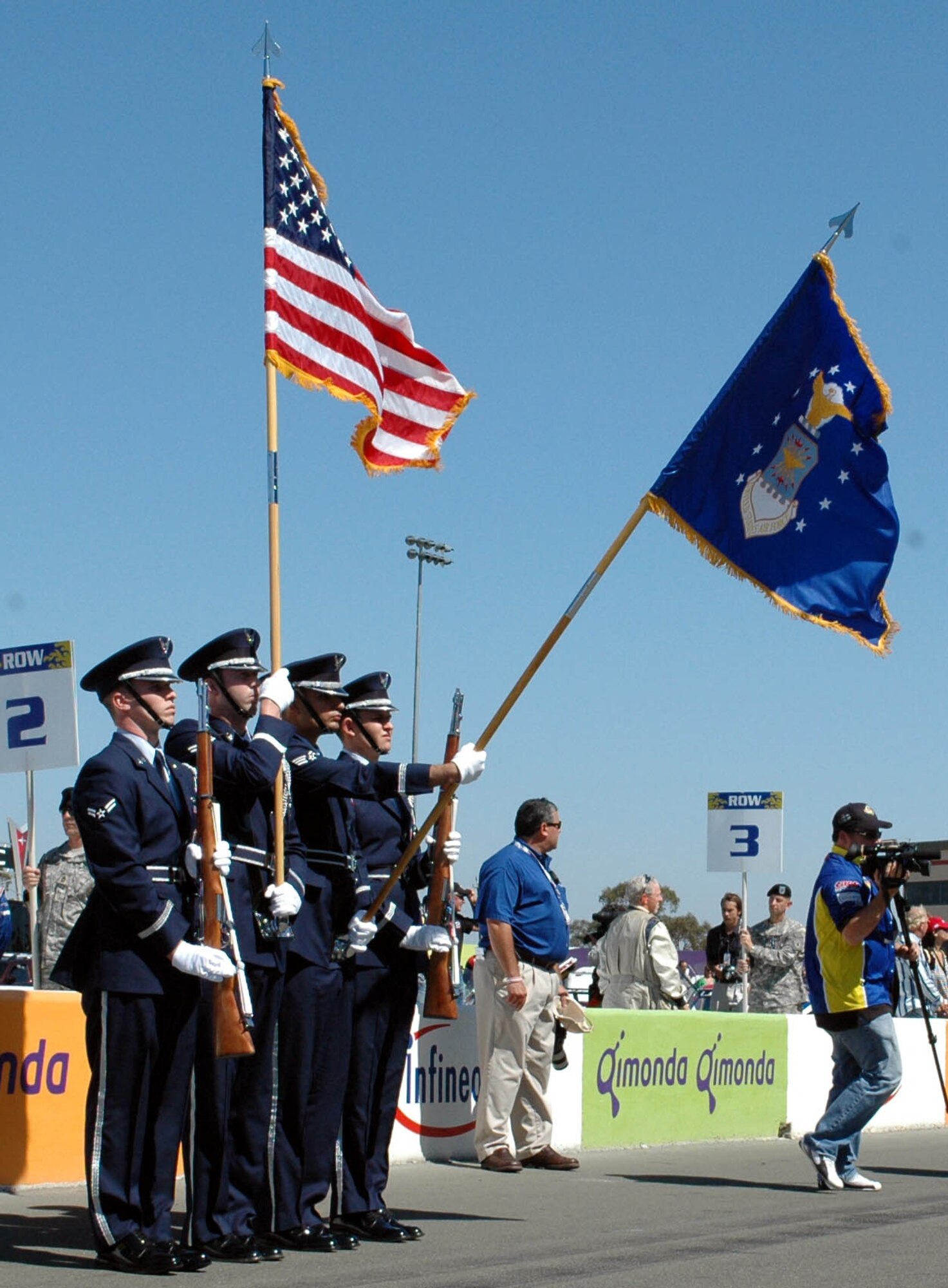 Members of the Travis Honor Guard present the colors during the Grand-Am Armed Forces 250 pre-race ceremonies Aug. 25 at Infineon Raceway, Sonoma, Calif. (U.S. Air Force photo/Staff Sgt. Candy Knight)