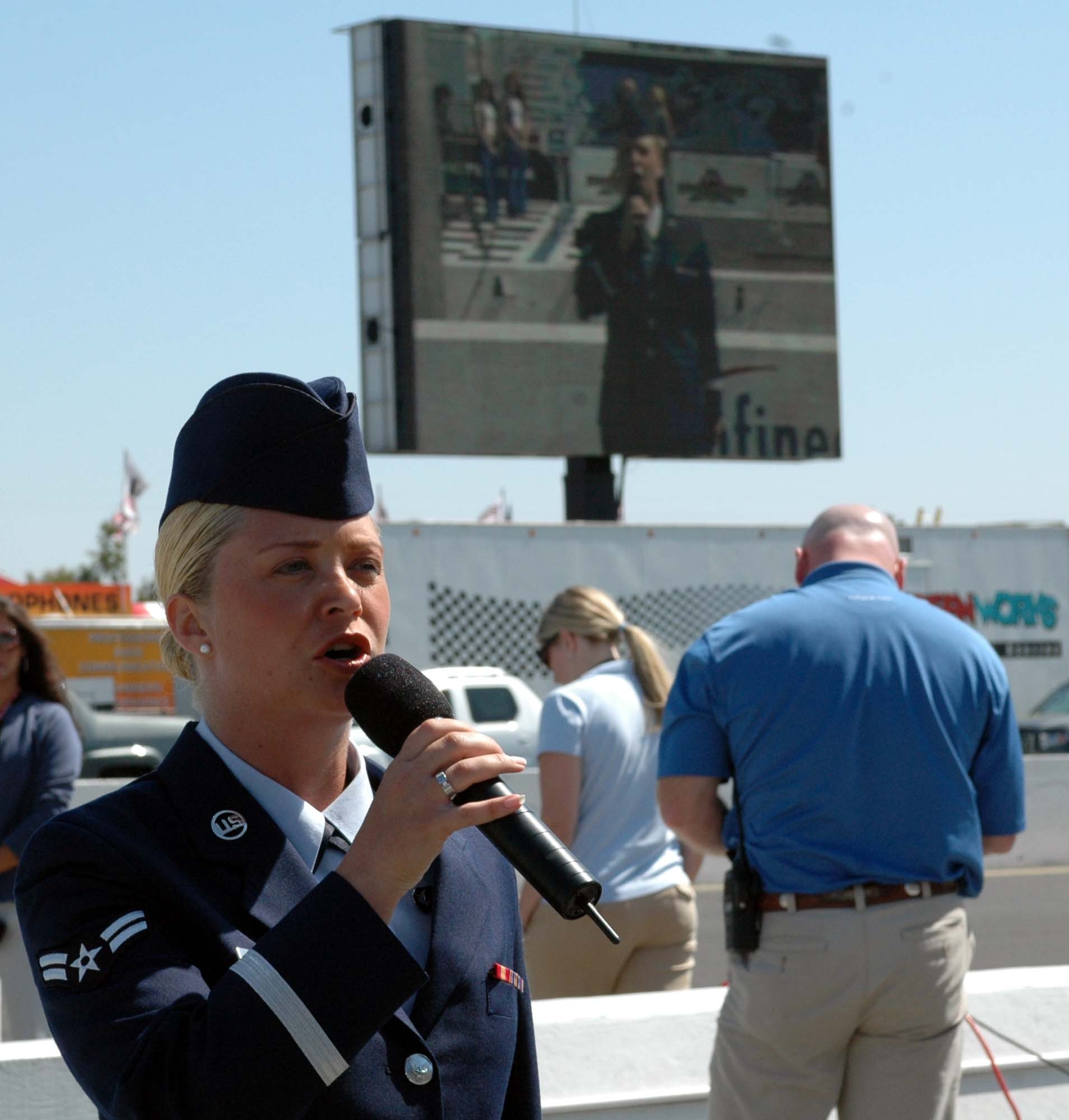 Airman 1st Class Pamela Kelley, USAF Band of the Golden West, sings "God Bless America" during the Indy Pro-Series pre-race ceremonies Aug. 25 at Infineon Raceway, Sonoma, Calif. (U.S. Air Force photo/Staff Sgt. Candy Knight)