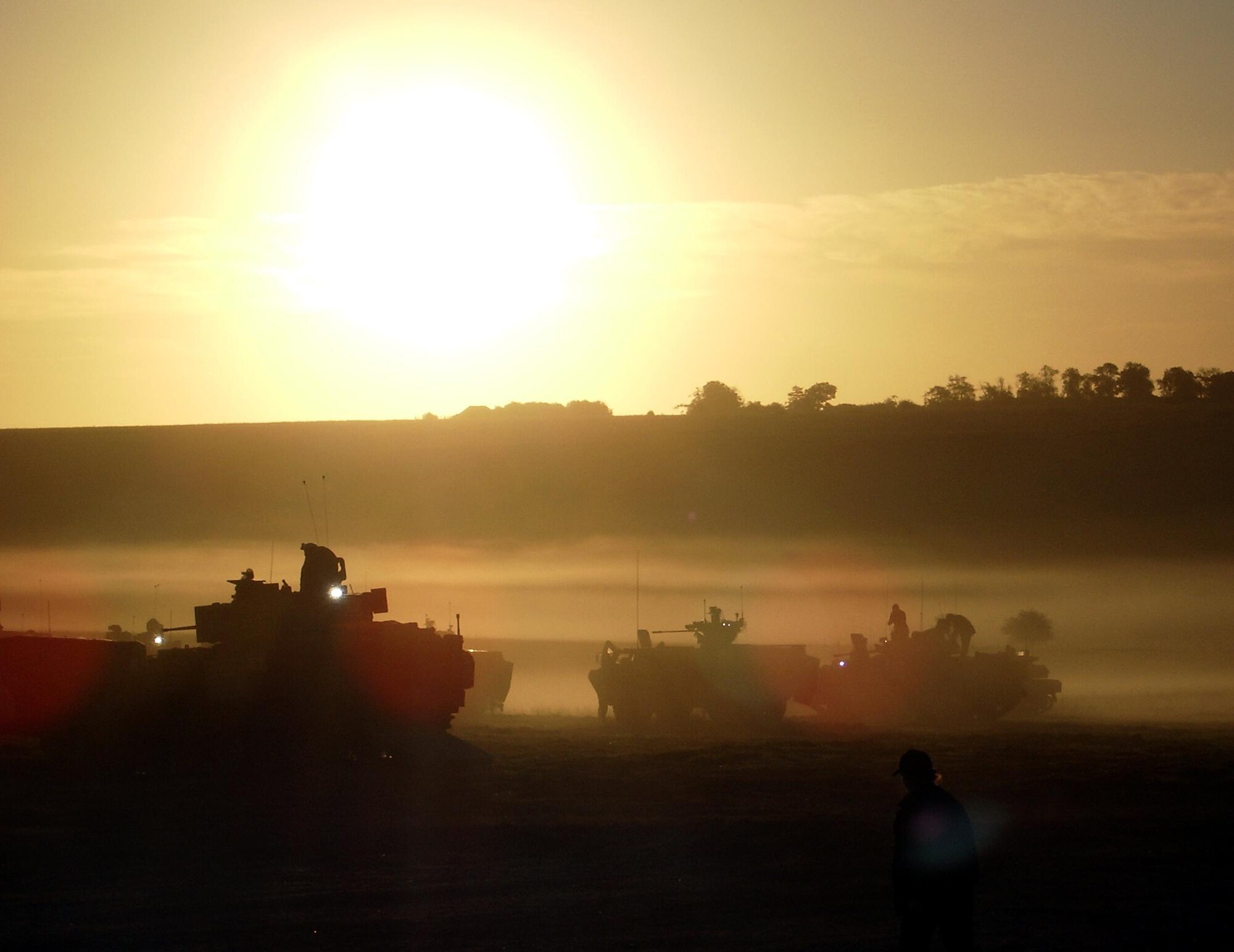 A U.S. Bradley Fighting Vehicle, a French VAB Armored Vehicle and a Italian Dardo Infantry Fighting Vehicle stand poised for exercises. U.S. and Coalition forces prepare for a capstone Coalition Combat Identification exercise to be held at Nellis Air Force Base, Nev., and Fort Irwin, Calif., from 7-19 Sept. (U.S. Air Force photo by Dave Williams)