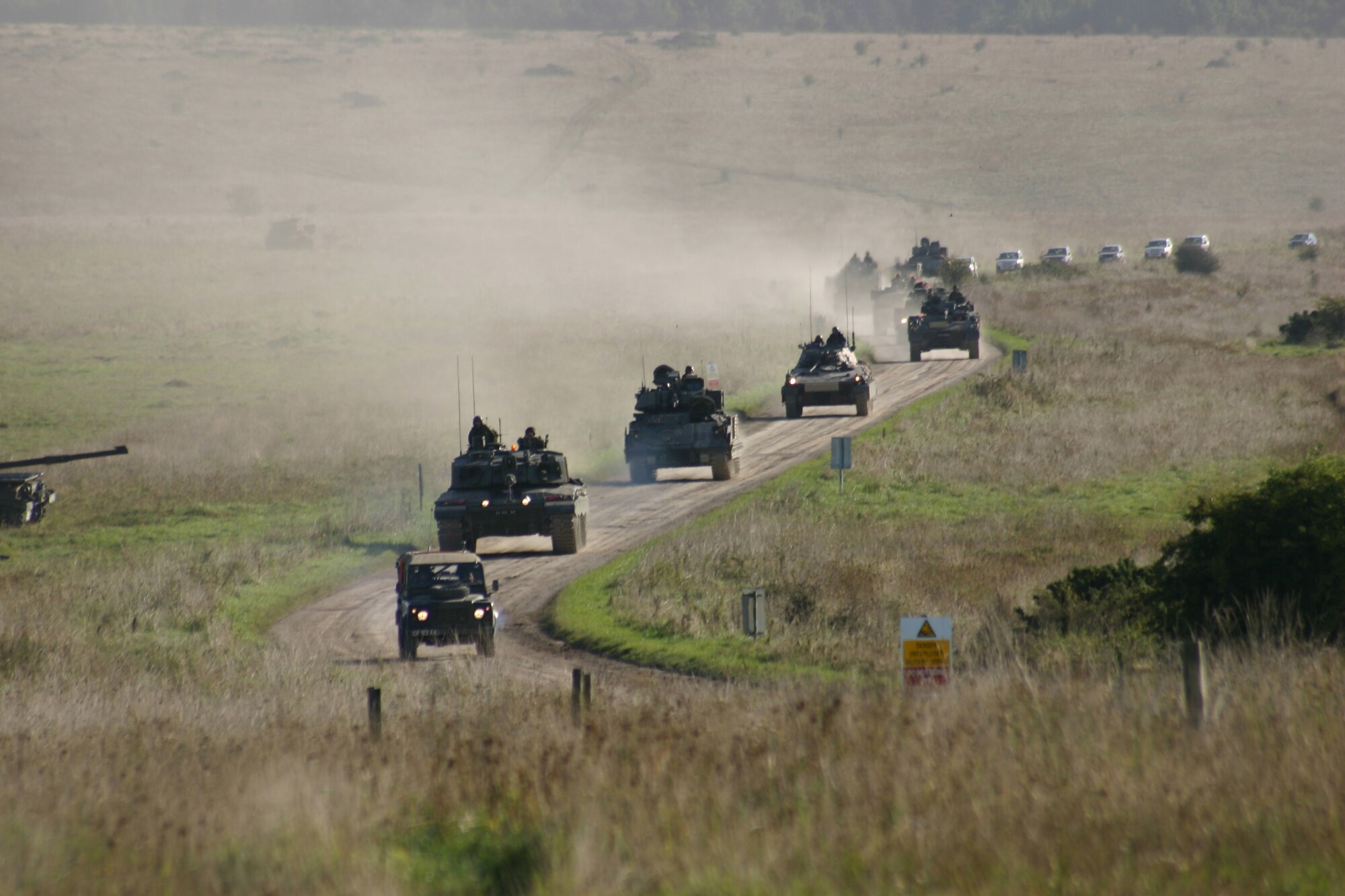 A column of Coalition vehicles move towards defensive positions in preparation for a Coalition Combat Identification exercise. The upcoming Bold Quest exercise at Nellis Air Force Base, Nev. and the National Training Center at Fort Irwin, Calif. will be the premier CCID event for U.S. Joint Forces Command and JFIIT this year. (U.S. Air Force photo by Marie LaTouche)