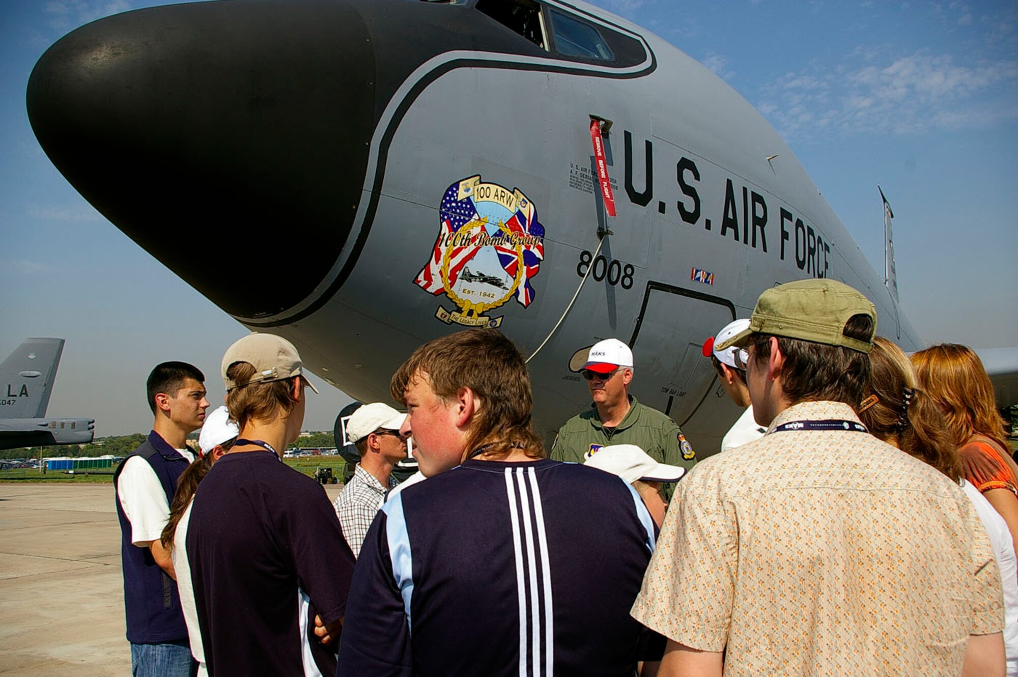 RAMENSKOYE AIRFIELD, Zhukovsky, Russia – Col. J.D. Clifton, 100th Operations Group commander, 100th Air Refueling Wing, Royal Air Force Mildenhall, England, talks with some "Moscow Children" Aug. 23 at the Moscow International Air Show. The children, aged between 6 and 16, visited the show as part of a program called Moscow Open Festival for Children's Creativity. They were all born during the air show since it began 16 years ago, and are from local towns. About 60 children attended and took part in activities during the day, which included seeing the U.S. Air Force aircraft. Leading up to the competition, all the children either made models or did artwork, which was later judged. There were four categories -- aviation, space craft, handicrafts and artwork, which were all judged in a competition. The top three winners in each group received prizes, and members from the U.S. Air Force presented the children with additional aviation materials, such as models of Air Force aircraft, pens, pencils and pins. The air show runs through Aug. 26 and includes DOD participation of static displays and aerial flight demonstrations. The air show is one of the premier events of its type in the world. U.S. participation in the air show demonstrates our commitment to international security, promotes international cooperation and contributes to U.S. foreign policy objectives. About 65 airmen from bases in Europe and the states are participating in this year’s air show. (U.S. Air Force photo by Karen Abeyasekere)