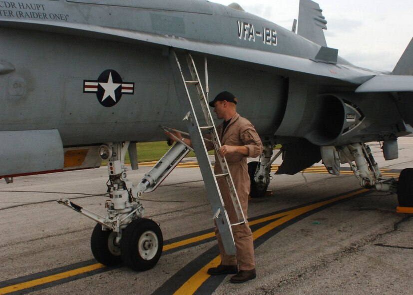 DYESS AIR FORCE BASE, Texas--Lt Ryan Hill, USN F/A 18 Pilot, readies his aircraft and prepares to participate in the air show held at Abilene Regional Airport, August 18, 2007. Lt Hill is stationed out of Lemoore Naval Air Station, CA. (U.S Air Force photo by Airman 1st Class Felicia Juenke)