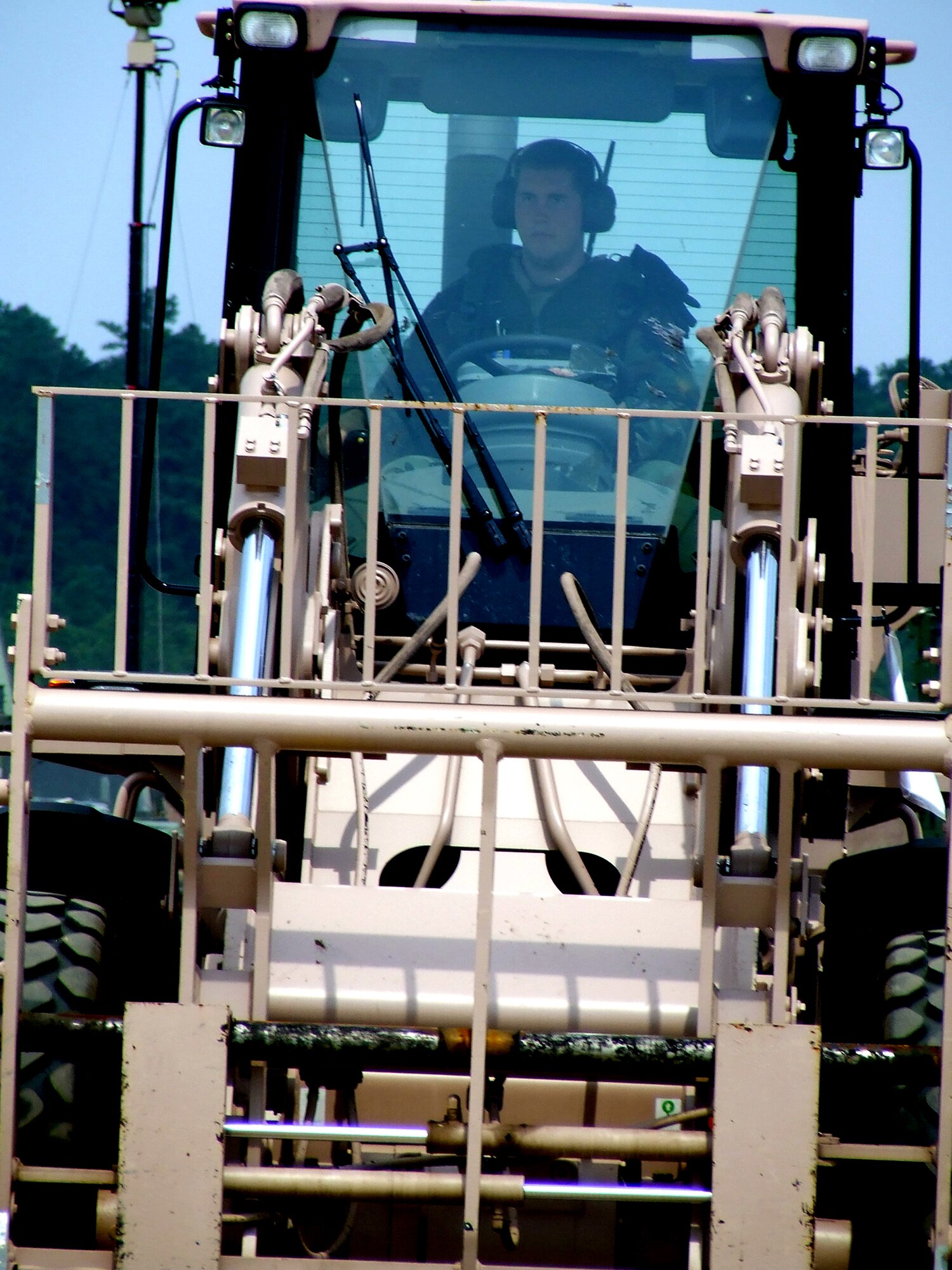 A U.S. Air Force Airman assigned to the 816th Contingency Response Group, McGuire Air Force Base, N.J., operates an extreme terrain forklift during operations for Air Force Exercise Eagle Flag 07-6 at Naval Air Engineering Station Lakehurst, N.J., Aug. 25.  The exercise is operated by the U.S. Air Force Expeditionary Center's 421st Combat Training Squadron at Fort Dix, N.J..  (U.S. Air Force Photo/Tech. Sgt. Scott T. Sturkol)