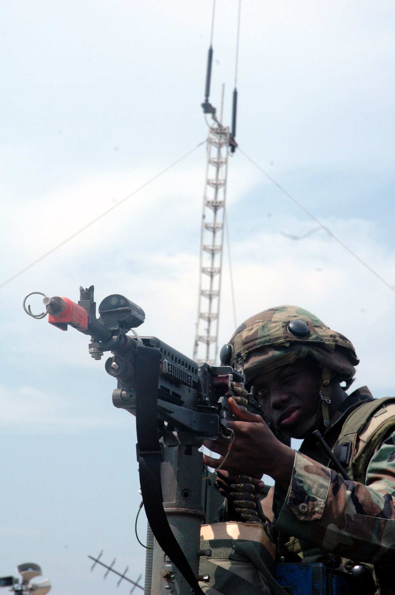 Airman 1st Class Cornelius Walton, 816th Contingency Response Group, McGuire Air Force Base, N.J., watches over a checkpoint Aug. 25 for the contingency response group camp during operations for Air Force Exercise Eagle Flag 07-6 at Naval Air Engineering Lakehurst, N.J.  The exercise is operated by the U.S. Air Force Expeditionary Center's 421st Combat Training Squadron at Fort Dix, N.J.  (U.S. Air Force Photo/Tech. Sgt. Scott T. Sturkol)