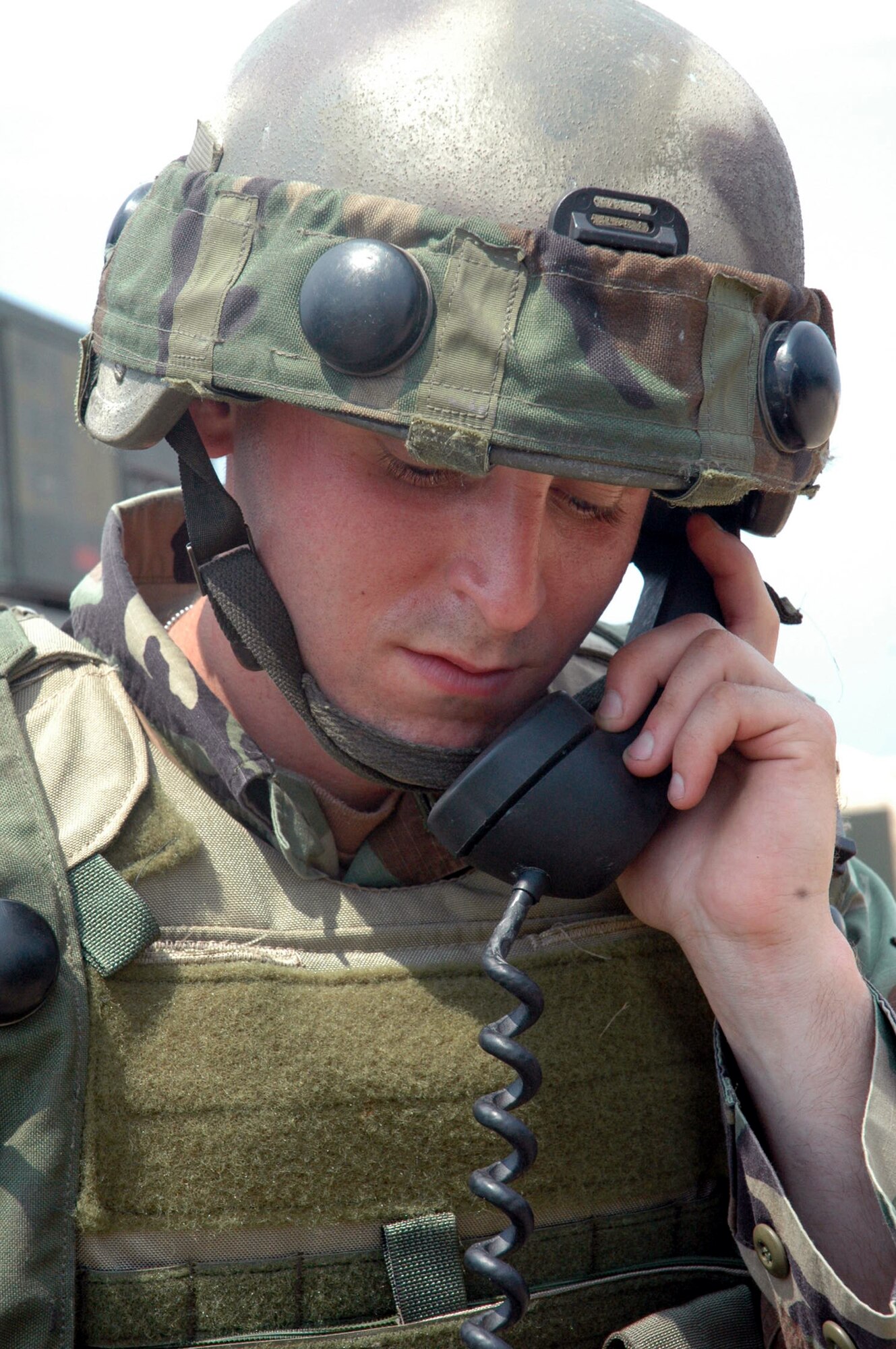 Senior Airman Thomas Sippel, 305th Security Forces Squadron, McGuire Air Force Base, N.J., talks on a field phone near a checkpoint for the contingency response group camp during operations for Air Force Exercise Eagle Flag 07-6 at Naval Air Engineering Lakehurst, N.J.  Airman Sippel deployed to Eagle Flag with the 816th Contingency Response Group, also from McGuire.  The exercise is operated by the U.S. Air Force Expeditionary Center's 421st Combat Training Squadron from Fort Dix, N.J.  (U.S. Air Force Photo/Tech. Sgt. Scott T. Sturkol)