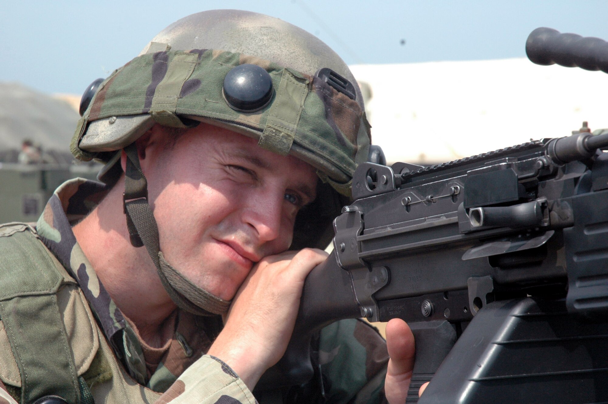 Senior Airman Thomas Sippel, 305th Security Forces Squadron, McGuire Air Force Base, N.J., watches over a checkpoint Aug. 25 for the contingency response group camp during operations for Air Force Exercise Eagle Flag 07-6 at Naval Air Engineering Lakehurst, N.J.  Airman Sippel deployed to Eagle Flag with the 816th Contingency Response Group, also from McGuire.  The exercise is operated by the U.S. Air Force Expeditionary Center's 421st Combat Training Squadron from Fort Dix, N.J.  (U.S. Air Force Photo/Tech. Sgt. Scott T. Sturkol)