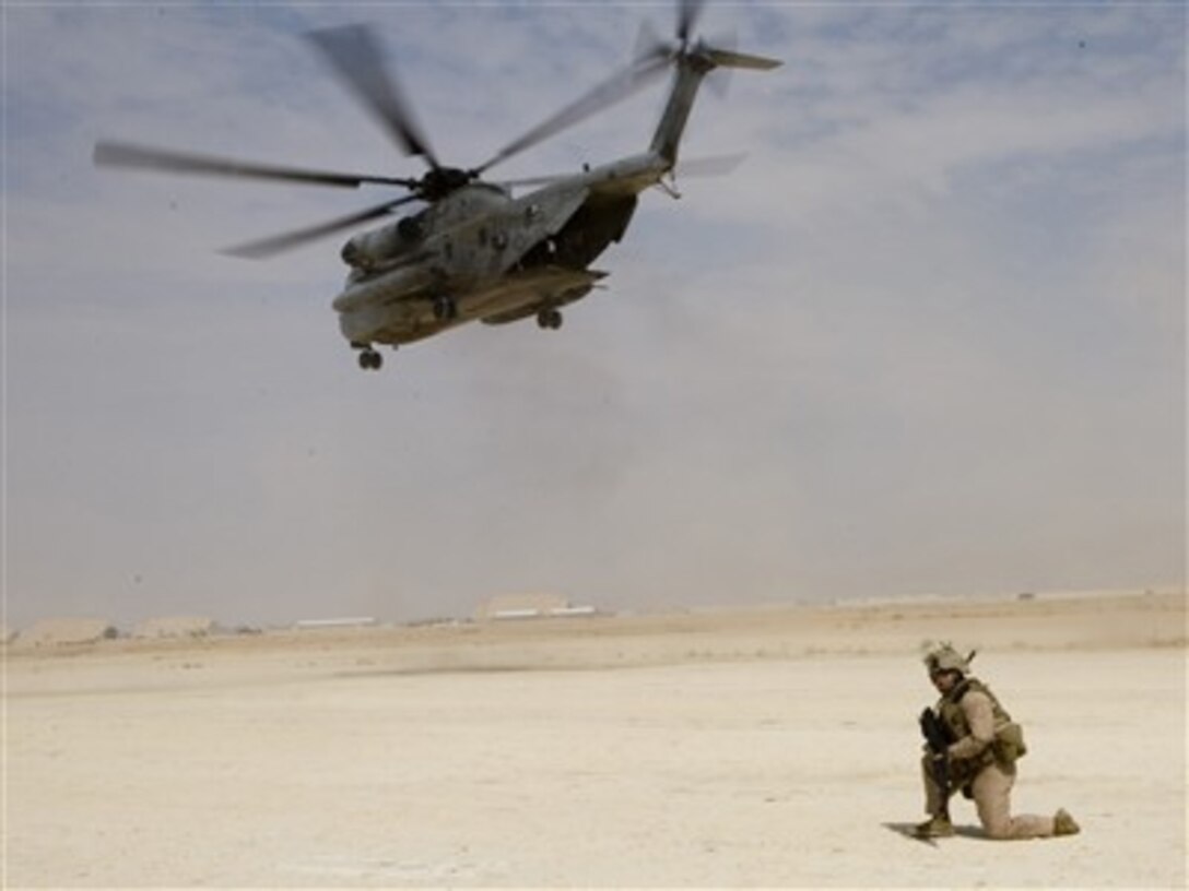 U.S. Marine Corps Lance Cpl. Jose F. Rivera provides landing zone security for Marine CH-53D Sea Stallion helicopters during an Aero Scout training operation near Al Asad, Iraq, on Aug. 20, 2007.  Rivera is attached to Regimental Combat Team 2.  