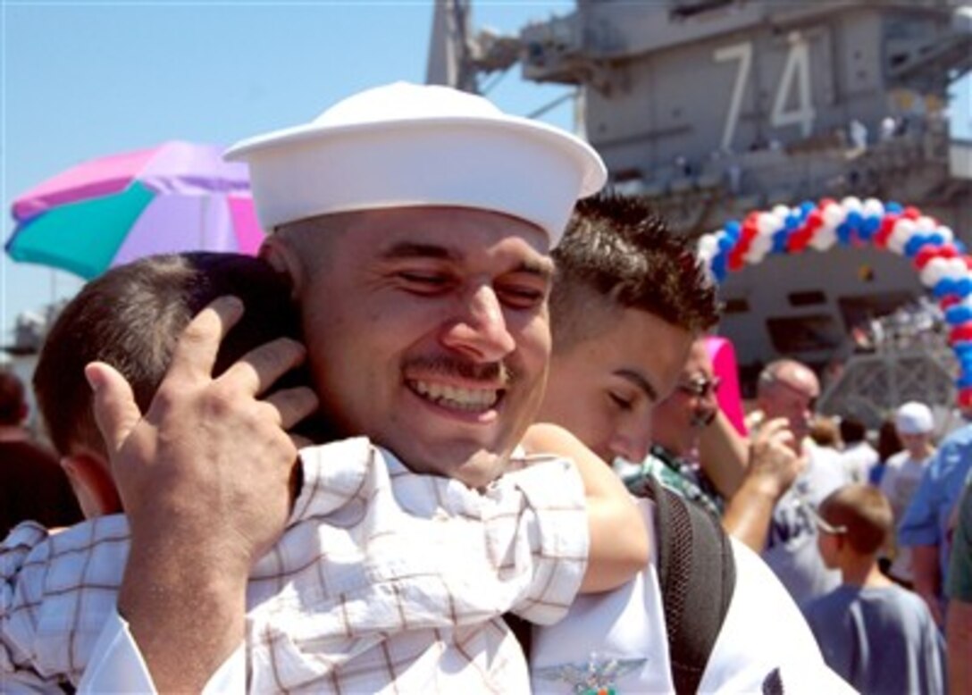 A sailor from the USS John C. Stennis (CVN 74) is greeted by his family as he arrives at Naval Air Station North Island, San Diego, Calif., on Aug. 27, 2007.  The aircraft carrier stopped in San Diego to offload Carrier Air Wing 9 before returning to its homeport of Bremerton, Wash.  