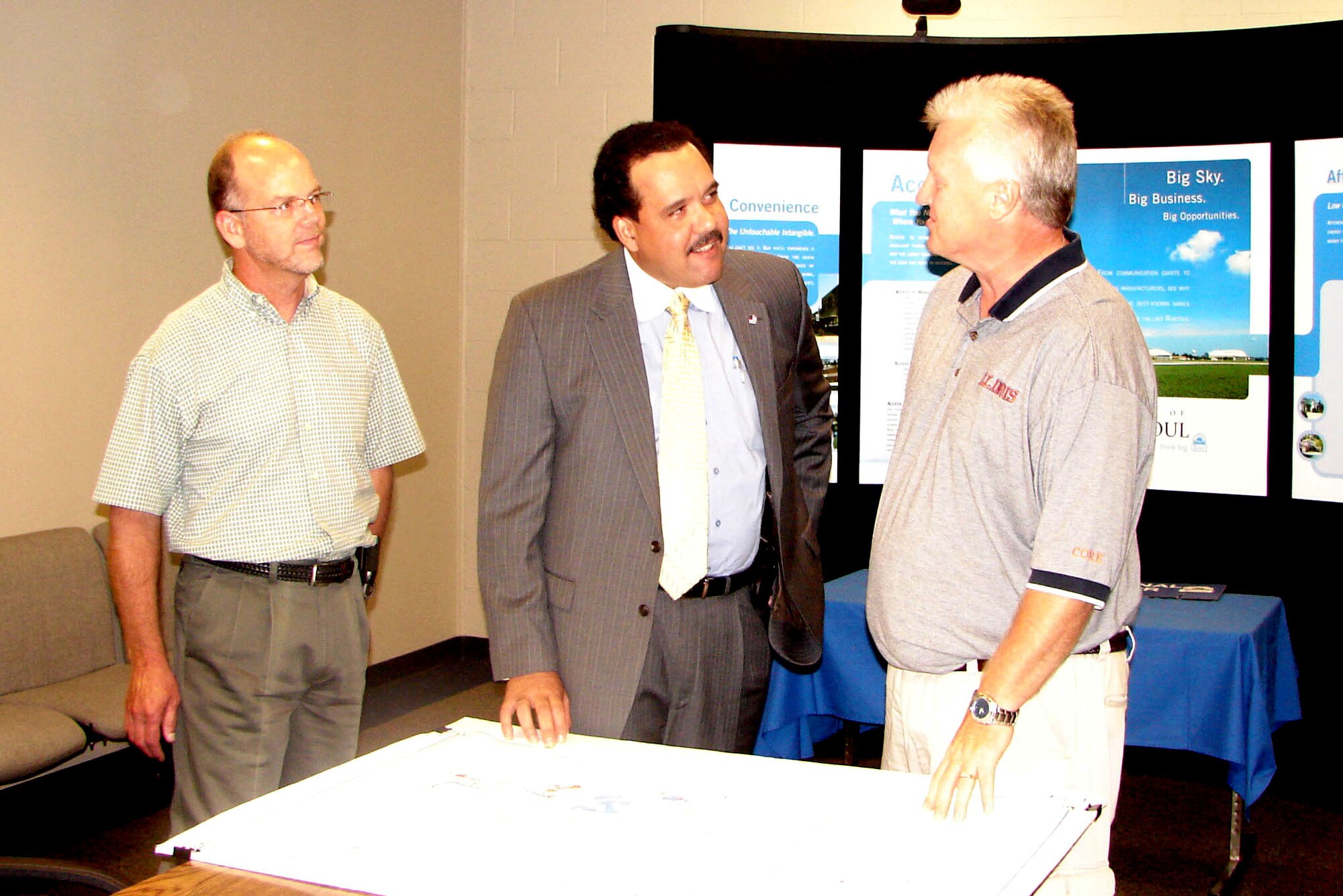 Air Force officials transferred more than 780 acres of the former Chanute Air Force Base to Rantoul, Ill., in a deed signing ceremony Aug. 16. At the ceremony were (from left): Paul Carroll, BRAC environmental coordinator for the former Chanute AFB; Adam Antwine, senior representative of Air Force Real Property Agency; and Rantoul Mayor Neal Williams. (U.S. Air Force photo)