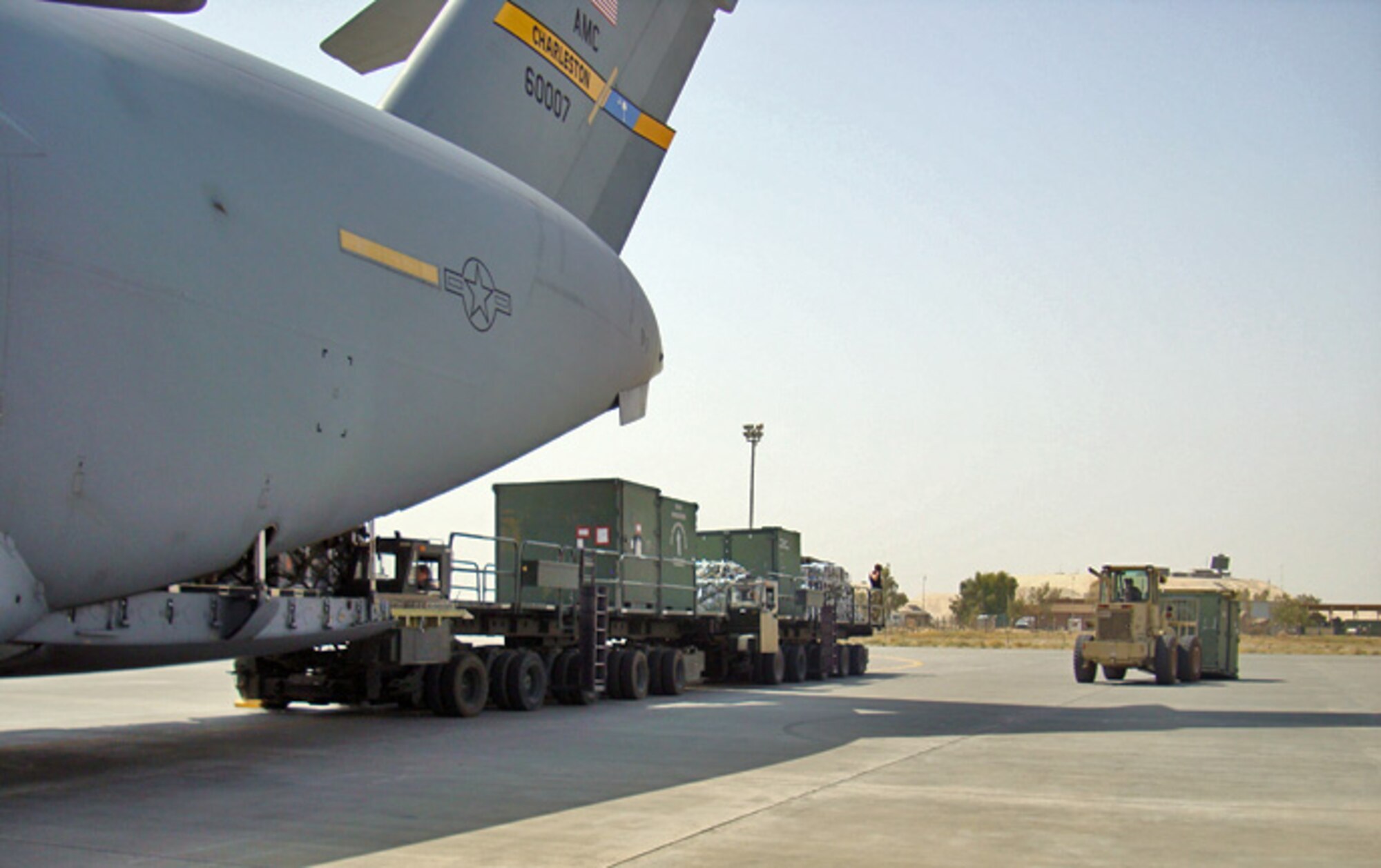 A C-17 crew from the 14th Airlift Squadron delivers passengers, equipment and supplies to Southwest Asia Aug. 1.  This mission provided support for the arrival of members from the Vermont Air National Guard's 158th Fighter Wing, "The Green Mountain Boys," in a deployed location in Southwest Asia. (U.S. Air Force photo/Capt. William Brown)                     