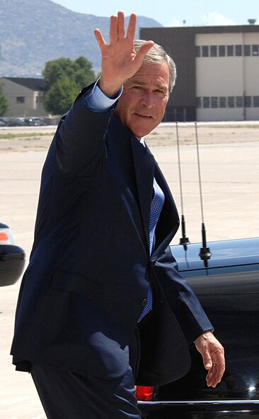 President Bush waves to the Airmen on the Kirtland Air Force Base flightline as he departs for his luncheon in Albuquerque, New Mexico, Aug. 27.  U.S. Air Force photo by Helga Carter