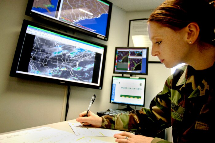 Senior Airmen Susan Snyder, 437th Operations Support Squadron weather forecast journeyman, fills out a mission execution forecast form at the Charleston AFB weather flight office for an aircrew before they go on a flight Tuesday.  (U.S. Air Force photo/Airman 1st Class Nicholas Pilch) 
