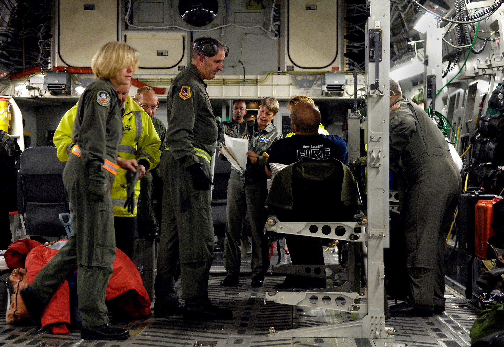 A medical team help a patient clear customs on board a C-17 Globemaster III after landing at Christchurch, New Zealand Aug. 28, 2007. The Airmen are from the 446th Aeromedical Evacuation Squadron, McChord Air Force Base, Wash. The medevac mission is being flown for a patient that requires more definitive medical treatment then can be handled in Antarctica. (U.S. Air Force photo/Tech. Sgt. Shane A. Cuomo)