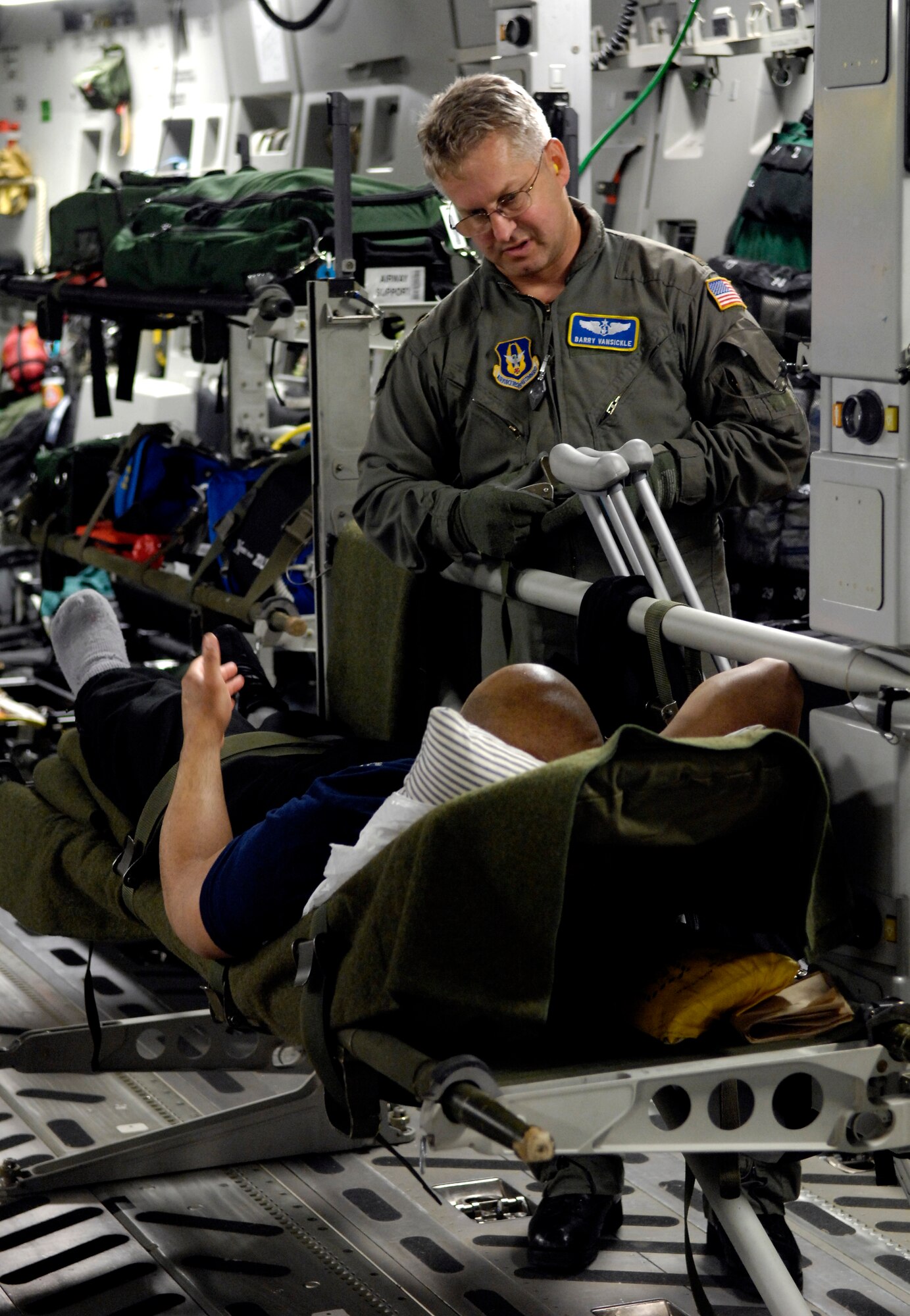 Maj. Barry Vansickle talks to a patient on board a C-17 Globemaster III medical evacuation flight from Antarctica Aug. 28, 2007. Maj. Vansickle is from the 446th Aeromedical Evacuation Squadron, McChord Air Force Base, Wash. The medevac mission is being flown for a patient that requires more definitive medical treatment then can be handled in Antarctica. (U.S. Air Force photo/Tech. Sgt. Shane A. Cuomo)