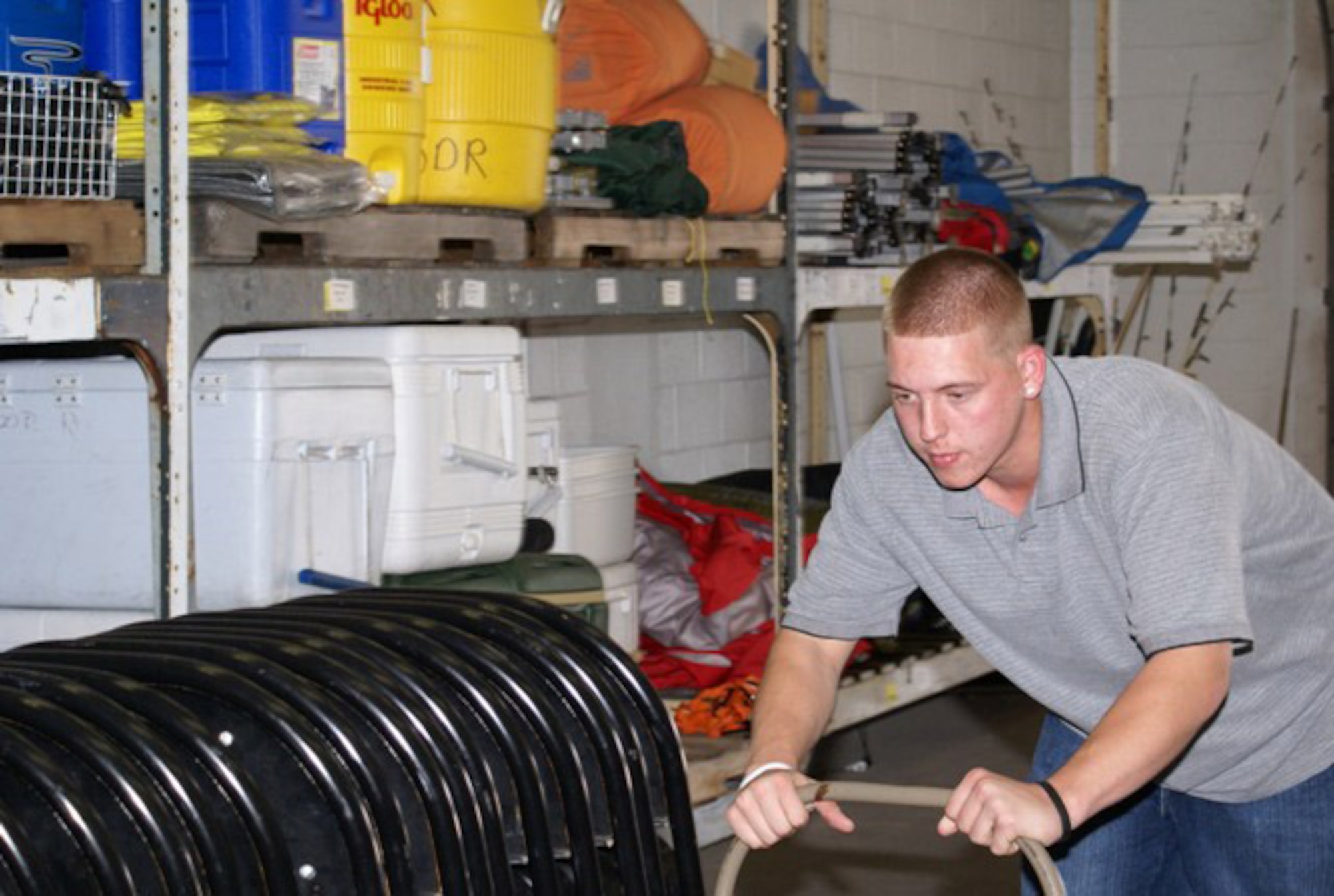 Mr. Chris Miller, 482nd Services Squadron Outdoor Recreation Office assistant, organizes the equipment storage room of the Homestead Air Reserve Base Outdoor Recreation Office Wednesday. The office serves as an affordable source for renting and buying equipment for outdoor activities and for arranging day trips and weekend getaways. (U.S. Air Force photo/Senior Airman Erik Hofmeyer)
