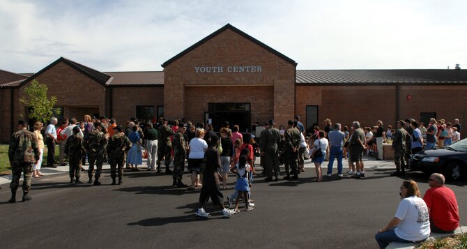 WHITEMAN AIR FORCE BASE, Mo. – Members of Team Whiteman gather at the youth center ribbon cutting ceremony Aug. 24. After much anticipation this 22-month long project now offers activities in the areas of character and leadership development, education and career development, health and life skills, the arts, school-age care, league sports, fitness, leisure and recreation. (U.S. Air Force photo/Airman 1st Class Stephen Linch)