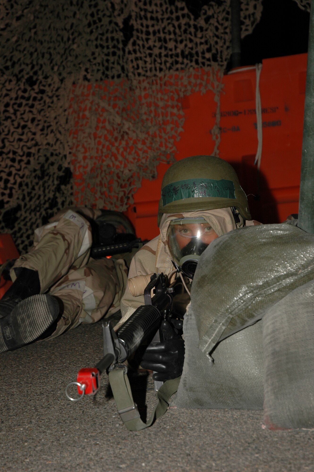MOUNTAIN HOME AIR FORCE BASE, Idaho -- Staff Sgt. Sherri Griffin, 366th Medical Support Squadron, guards her entry control point against an enemy ground attack during the base’s Sharpshooter exercise Aug. 29. The base conducts these combat readiness exercises to prepare for real world deployments and the wing’s upcoming operational readiness inspection in March 2008. (U.S. Air Force photo/ Senior Airman Megan Lyon)